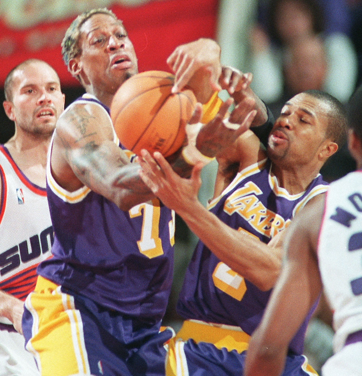 March 1, 1999; Phoenix, AZ, USA; FILE PHOTO; Los Angeles Lakers Dennis Rodman and Derek Fisher battle for a rebound while Phoenix Suns Rex Chapman watches. Mandatory Credit: Michael Chow-USA TODAY NETWORK  