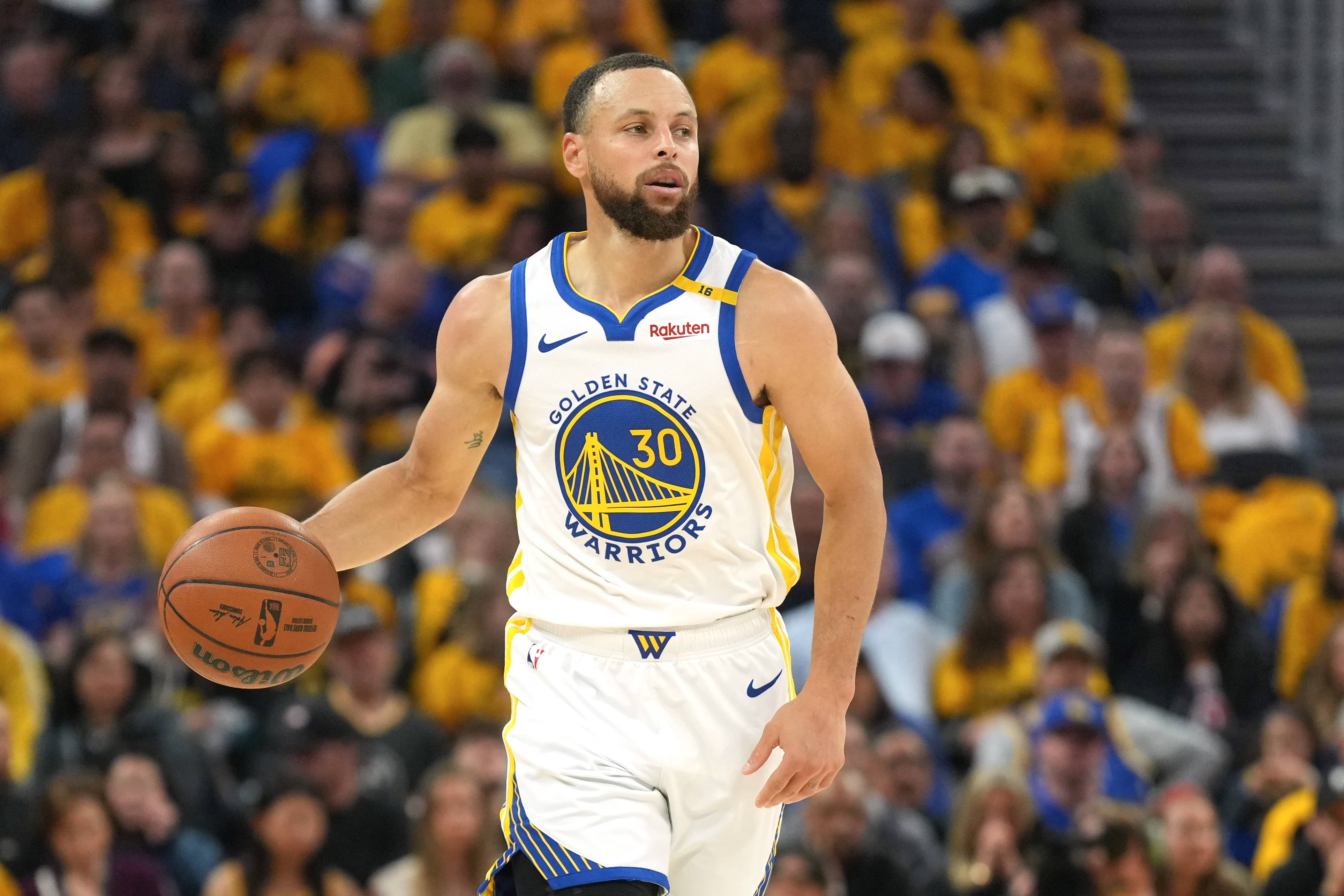 San Francisco, California, USA; Golden State Warriors guard Stephen Curry (30) dribbles against the Houston Rockets during the second quarter of Game 3 of the first round in the 2025 NBA Playoffs at Chase Center. Mandatory Credit: Darren Yamashita-Imagn Images