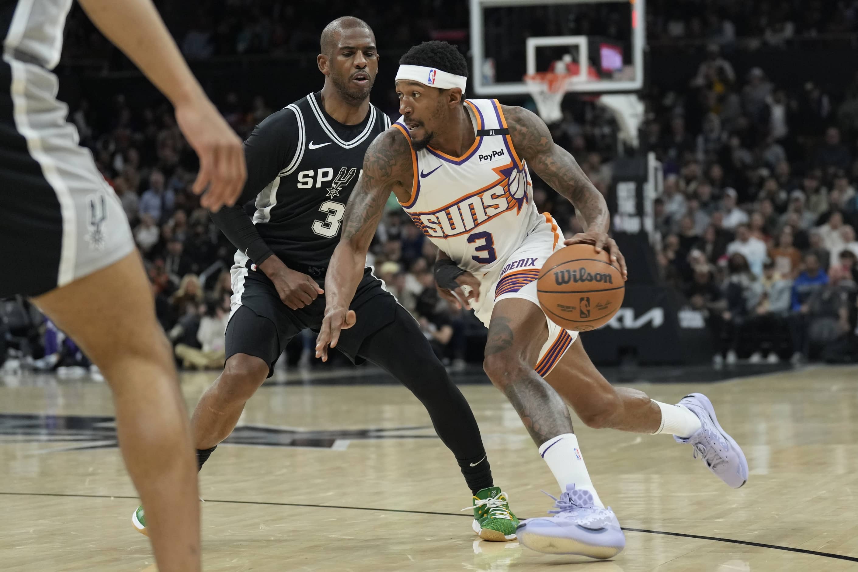 Phoenix Suns guard Bradley Beal (3) drives to the basket against San Antonio Spurs guard Chris Paul (3) during the first half at Moody Center.
