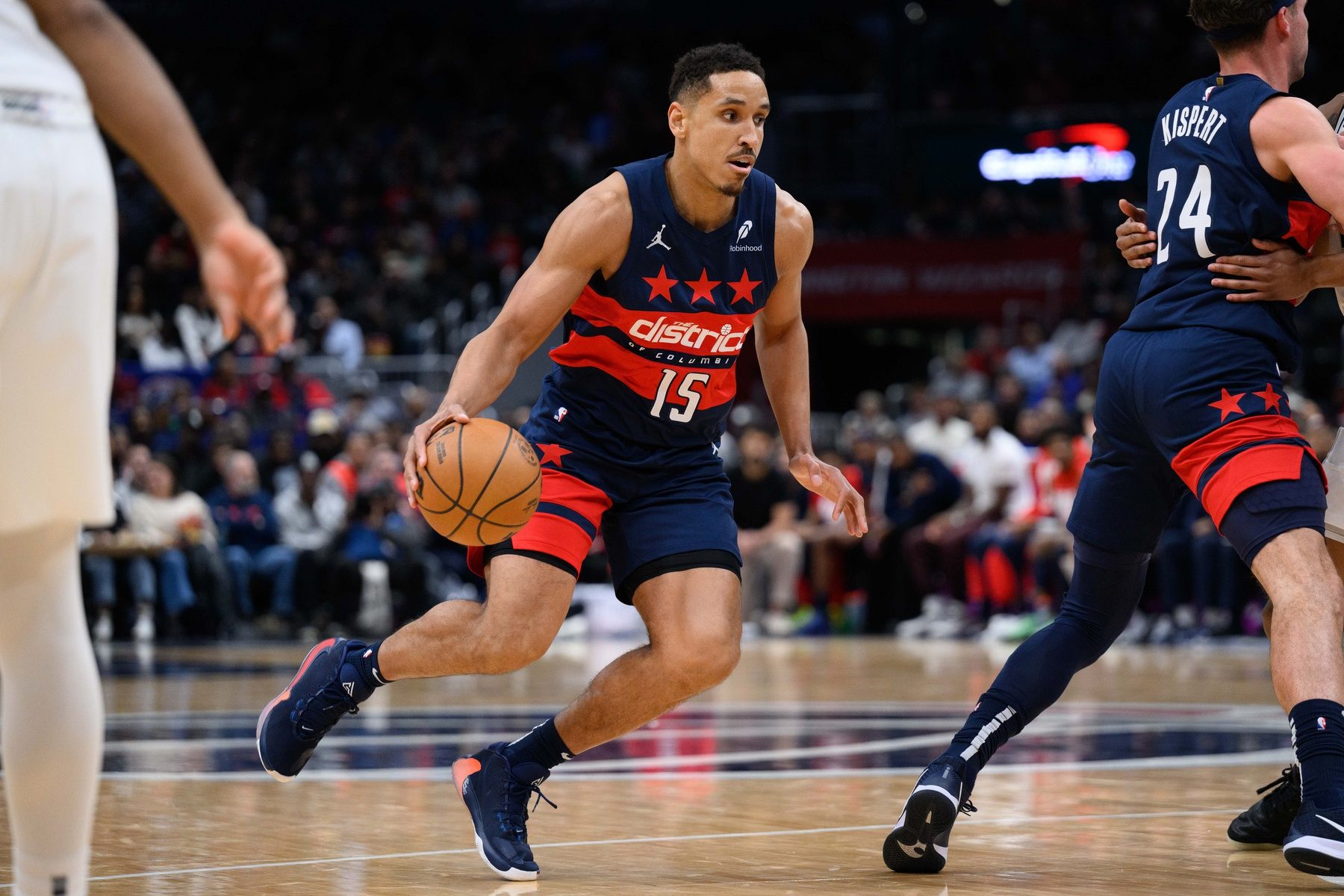 Washington Wizards guard Malcolm Brogdon (15) handles the ball during the first quarter against the San Antonio Spurs at Capital One Arena.