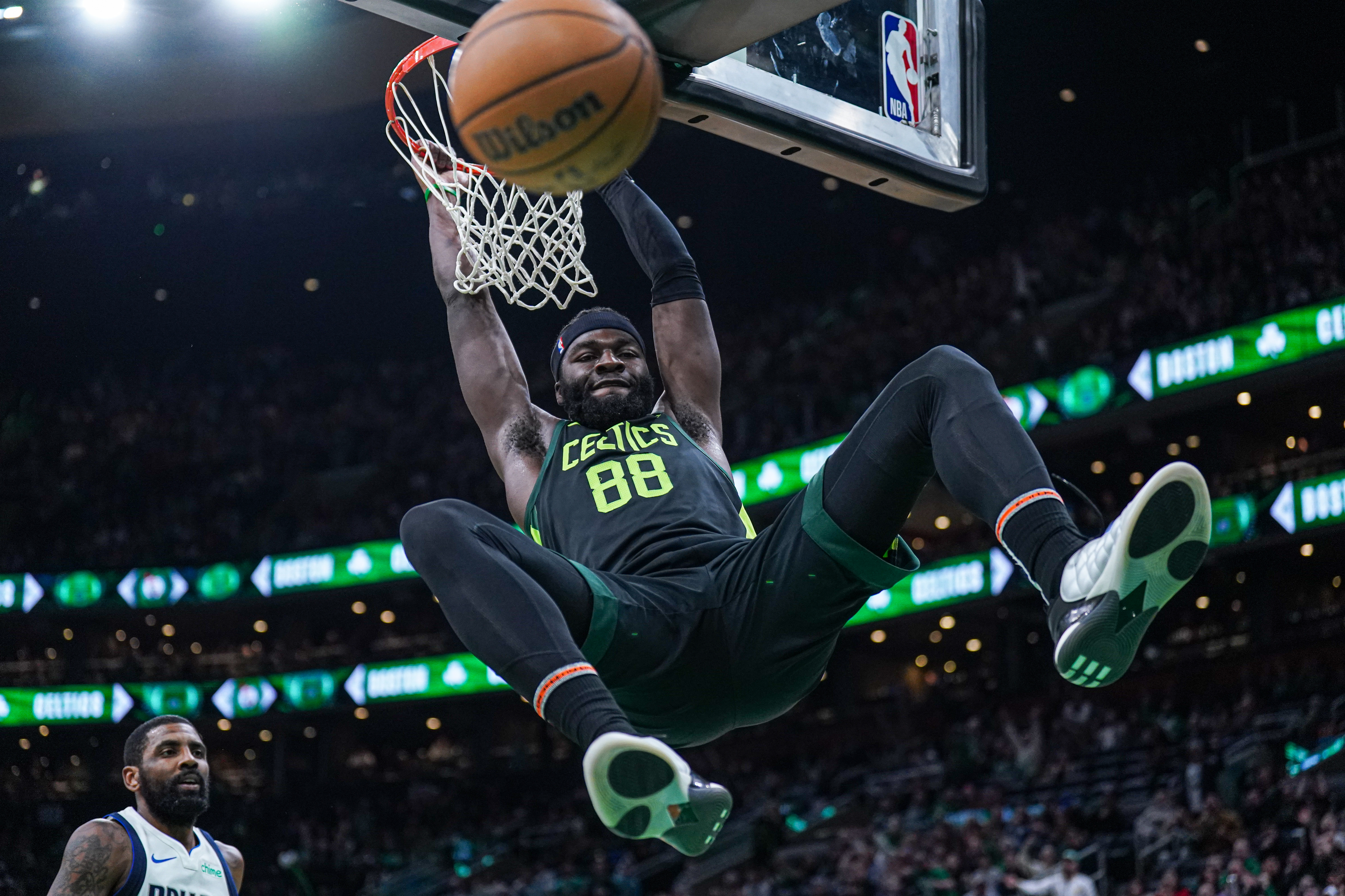 Feb 6, 2025; Boston, Massachusetts, USA; Boston Celtics center Neemias Queta (88) makes the basket against the Dallas Mavericks in the second half at TD Garden. Mandatory Credit: David Butler II-Imagn Images  