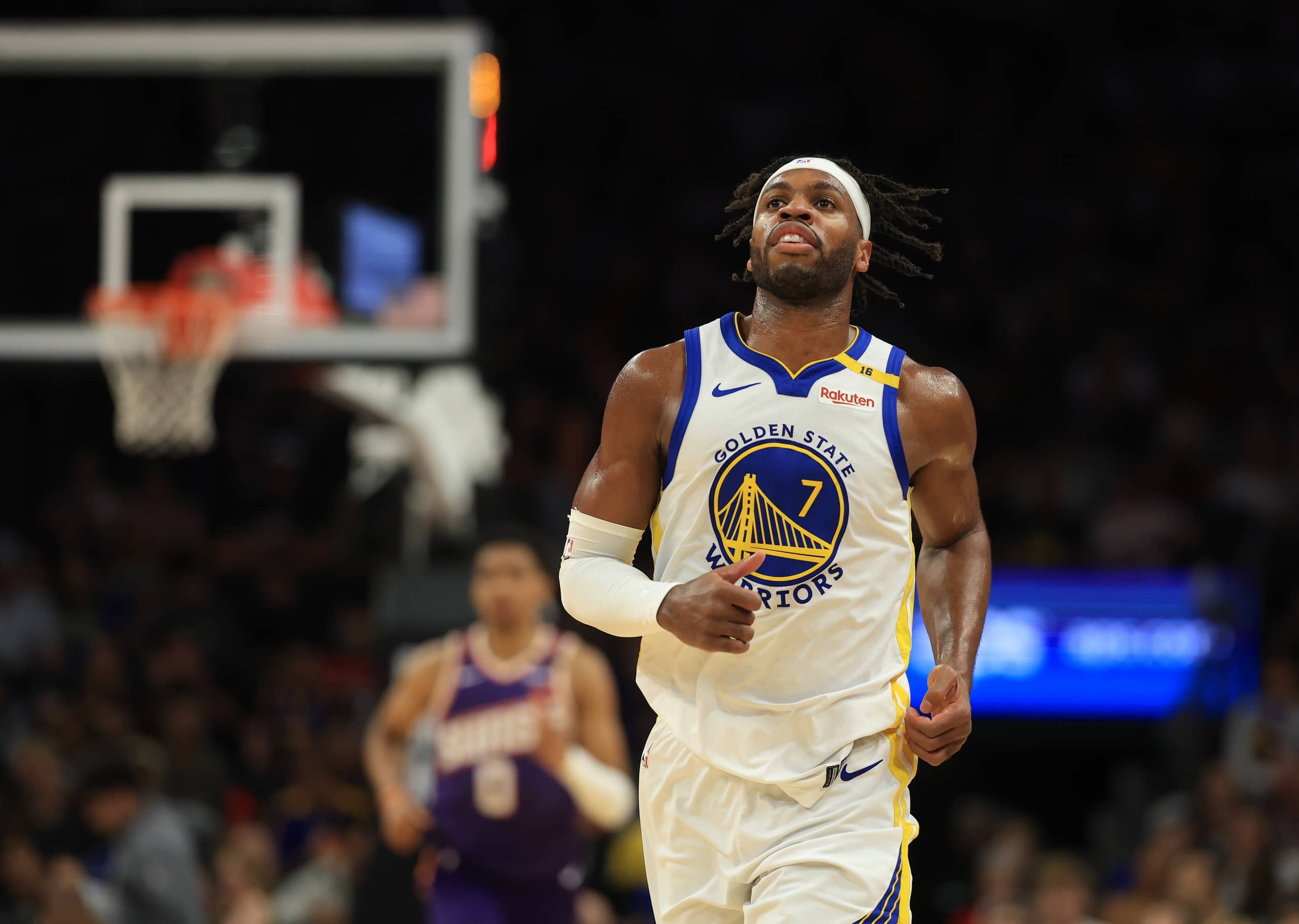 Apr 8, 2025; Phoenix, Arizona, USA; Golden State Warriors guard Buddy Hield (7) against the Phoenix Suns at Footprint Center. Mandatory Credit: Mark J. Rebilas-Imagn Images