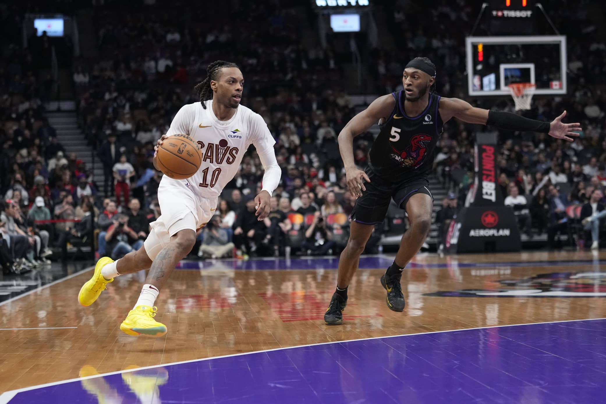 Cleveland Cavaliers guard Darius Garland (10) drives to the net against Toronto Raptors guard Immanuel Quickley (5) during the second half at Scotiabank Arena.