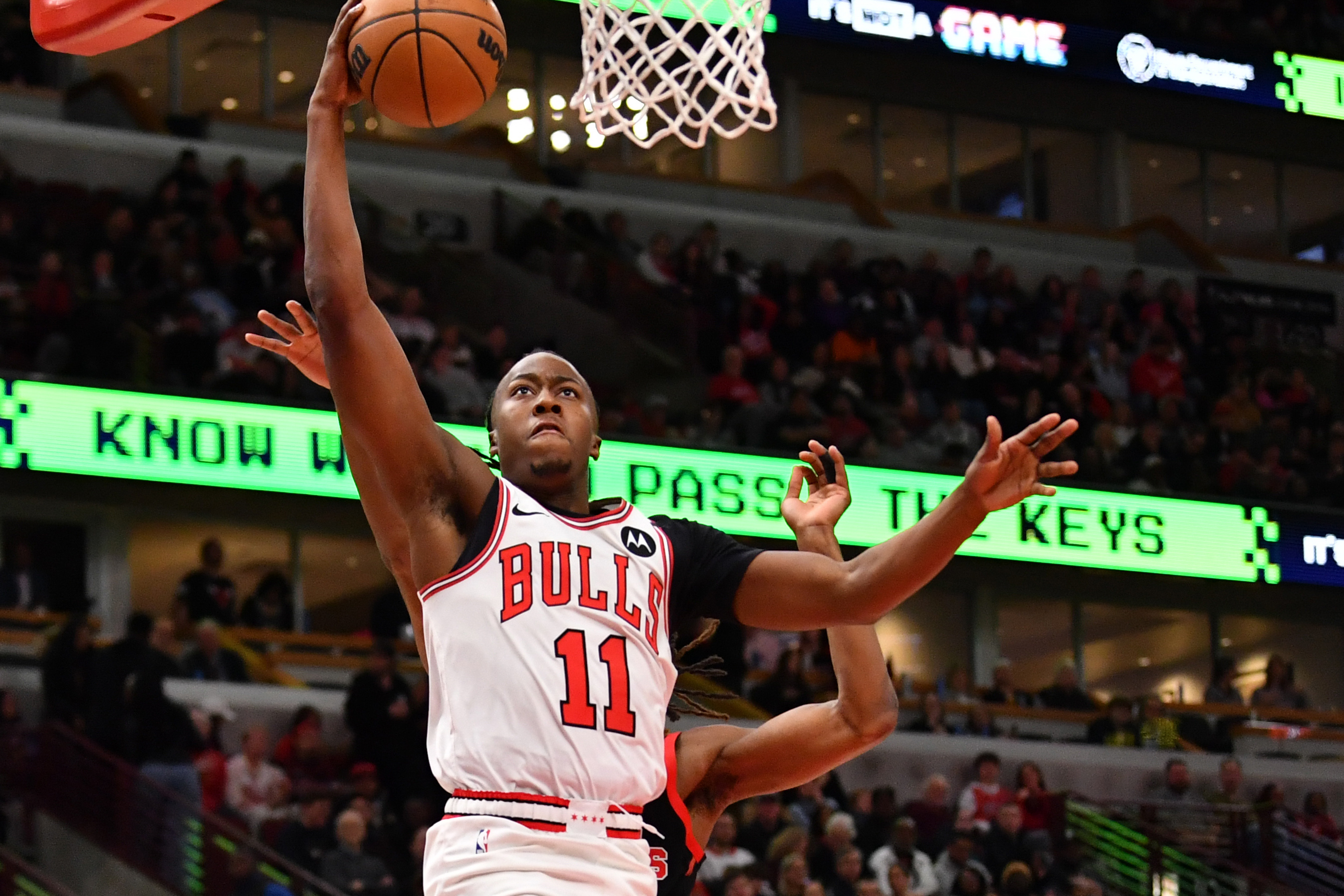 Feb 28, 2025; Chicago, Illinois, USA; Chicago Bulls guard Ayo Dosunmu (11) goes up for a shot during a game against the Toronto Raptors at the United Center. Mandatory Credit: Patrick Gorski-Imagn Images  