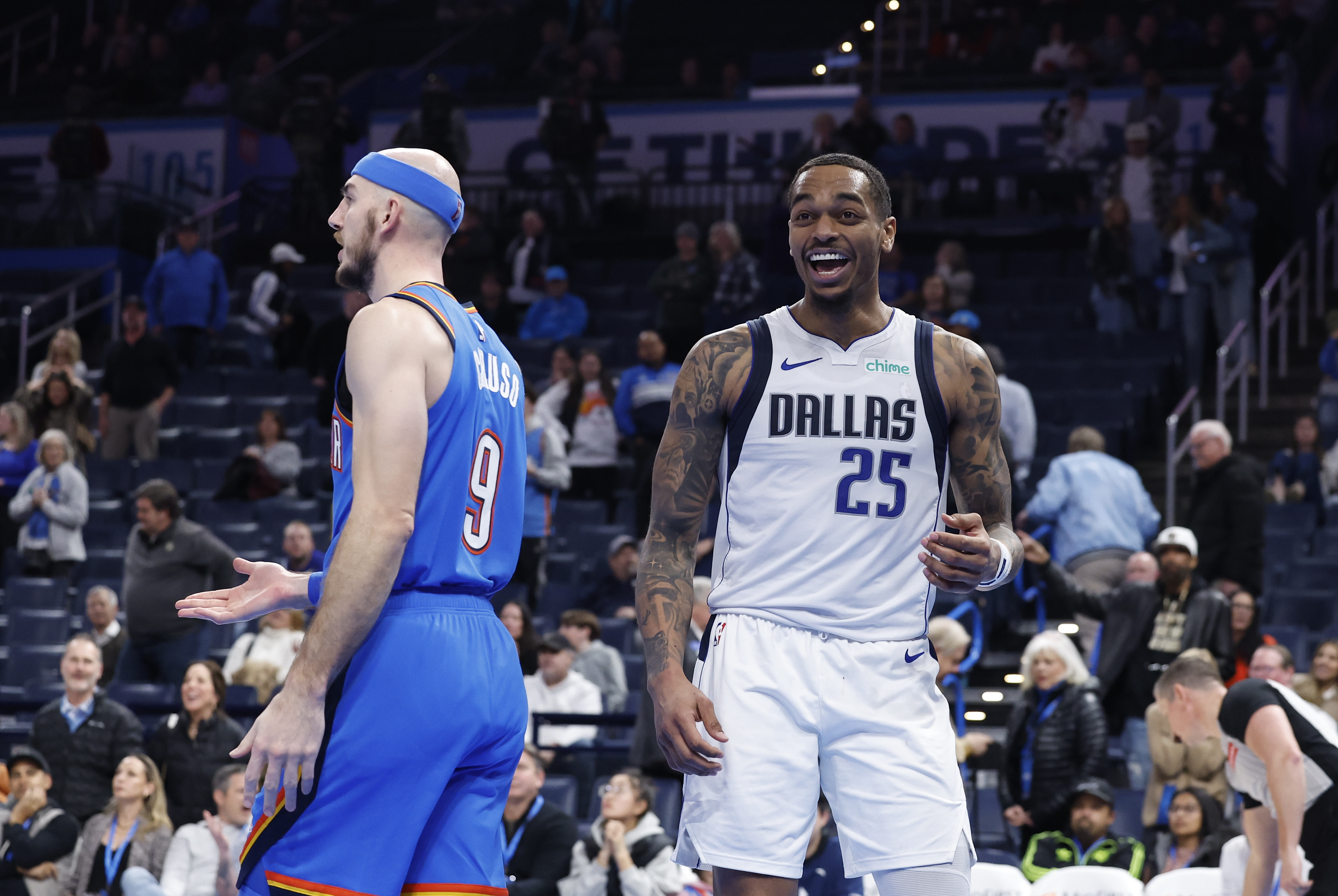 Jan 23, 2025; Oklahoma City, Oklahoma, USA; Dallas Mavericks forward P.J. Washington (25) laughs after a play against Oklahoma City Thunder guard Alex Caruso (9) during the second half at Paycom Center. Mandatory Credit: Alonzo Adams-Imagn Images  