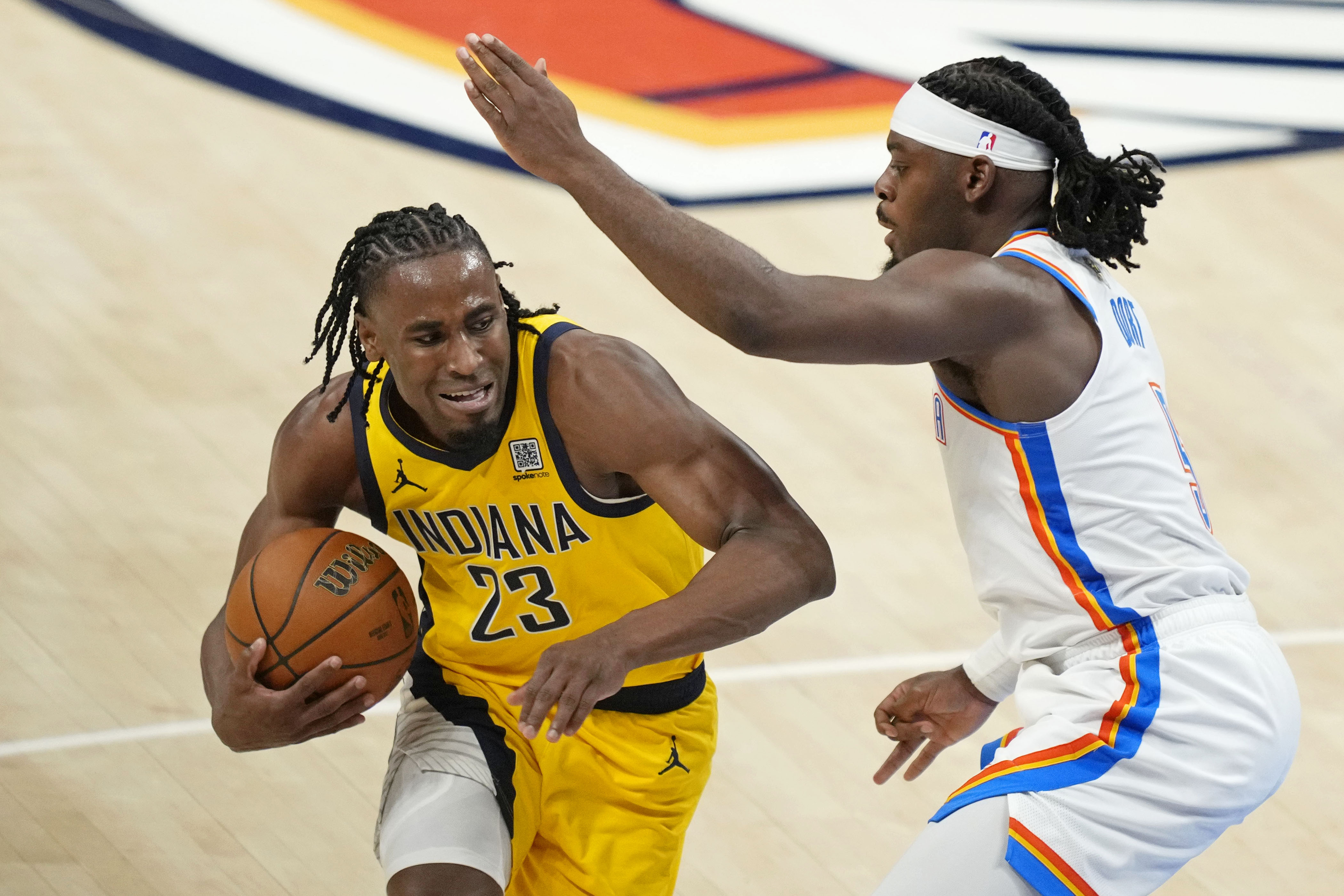 Jun 5, 2025; Oklahoma City, Oklahoma, USA; Indiana Pacers forward Aaron Nesmith (23) controls the ball against Oklahoma City Thunder guard Luguentz Dort (5) during the third quarter in game one of the 2025 NBA Finals at Paycom Center. Mandatory Credit: Kyle Terada-Imagn Images  