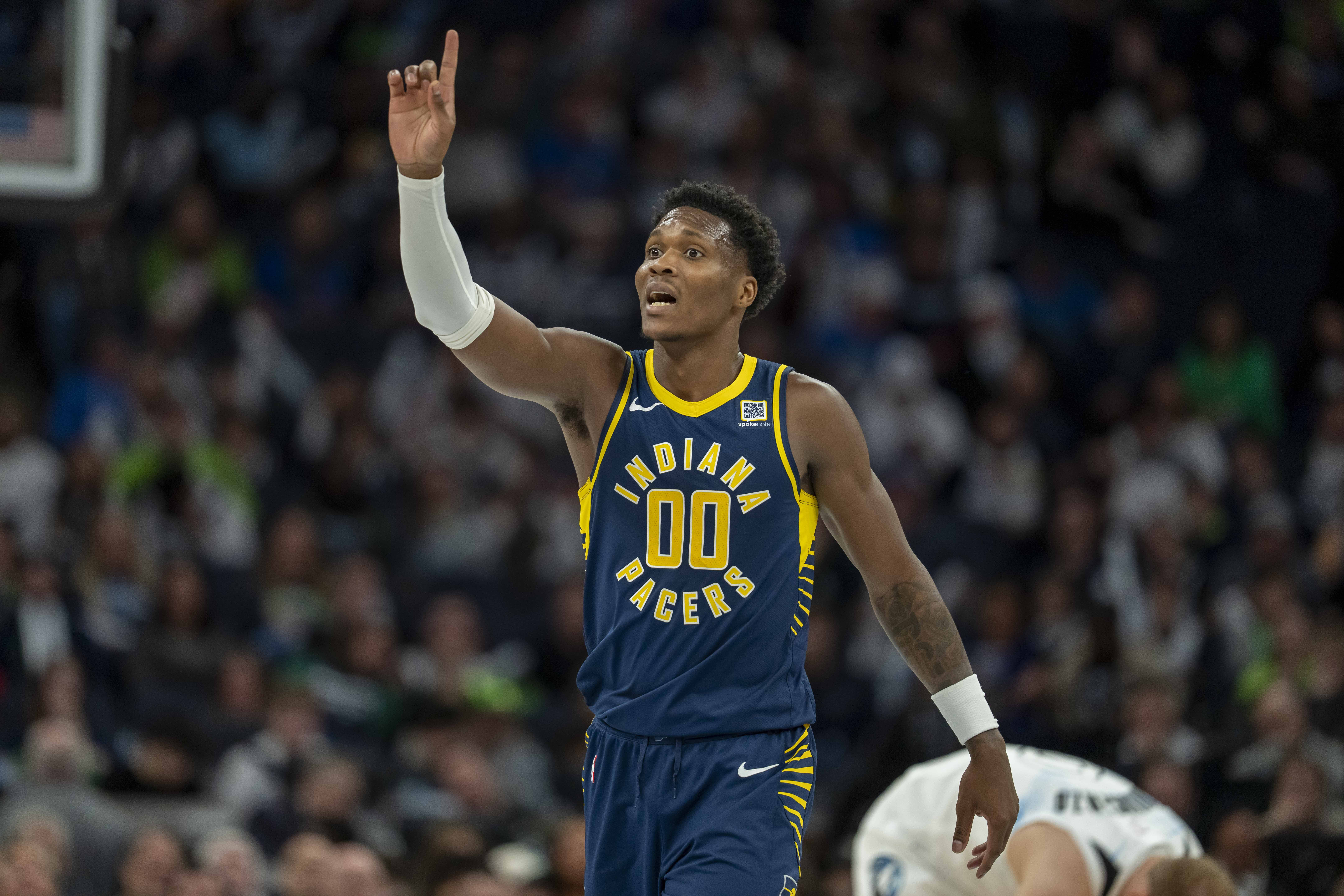 Mar 17, 2025; Minneapolis, Minnesota, USA; Indiana Pacers guard Bennedict Mathurin (00) reacts to a foul called against the Minnesota Timberwolves in the first half at Target Center. Mandatory Credit: Jesse Johnson-Imagn Images  