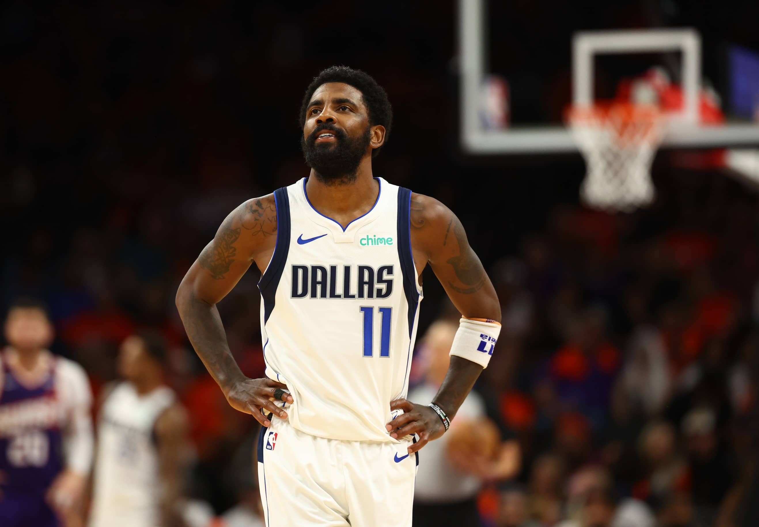 Oct 26, 2024; Phoenix, Arizona, USA; Dallas Mavericks guard Kyrie Irving (11) reacts against the Phoenix Suns in the second half at Footprint Center.