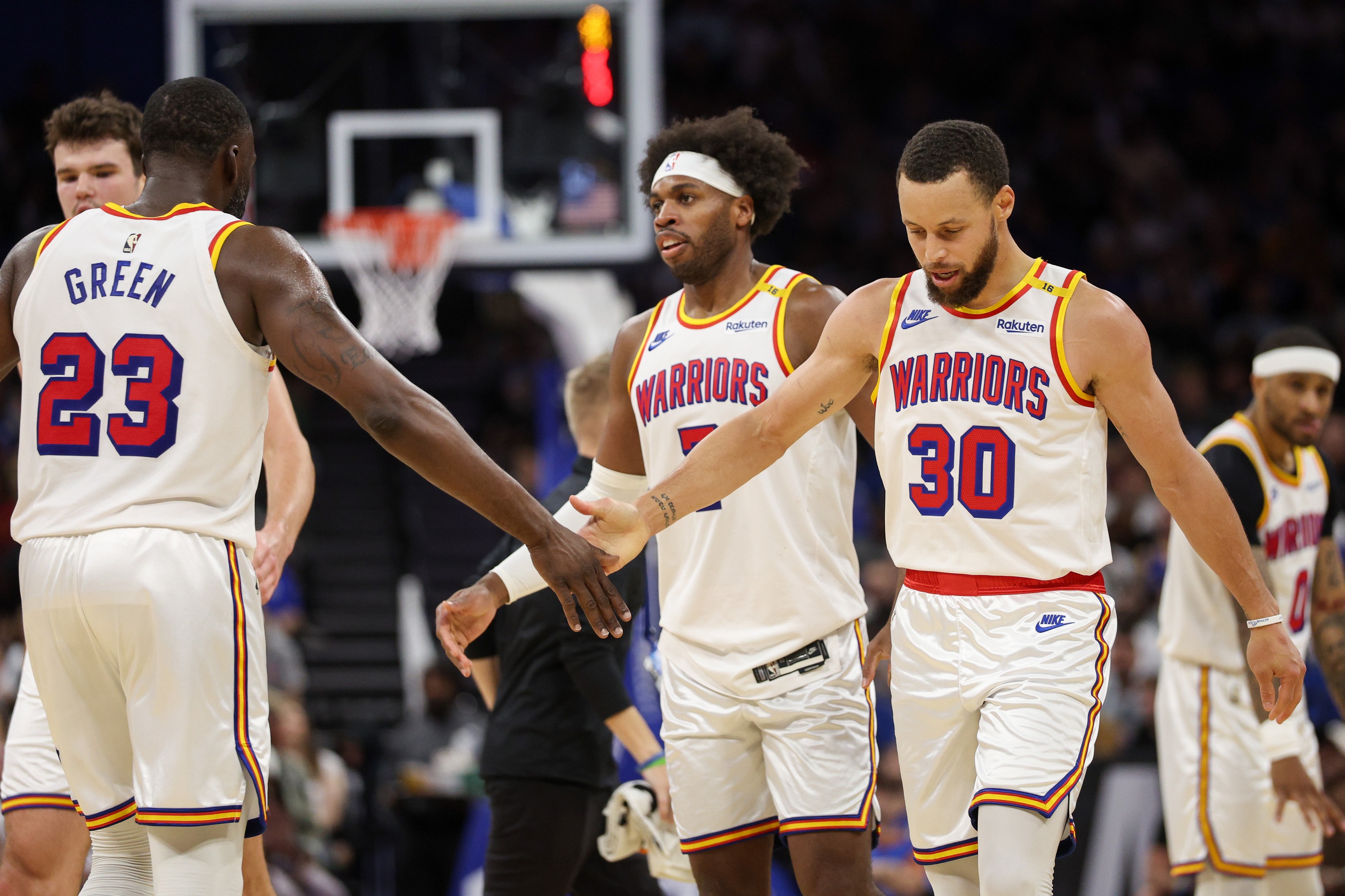 Feb 27, 2025; Orlando, Florida, USA; Golden State Warriors guard Stephen Curry (30) and forward Draymond Green (23) celebrate after a play against the Orlando Magic in the third quarter at Kia Center.