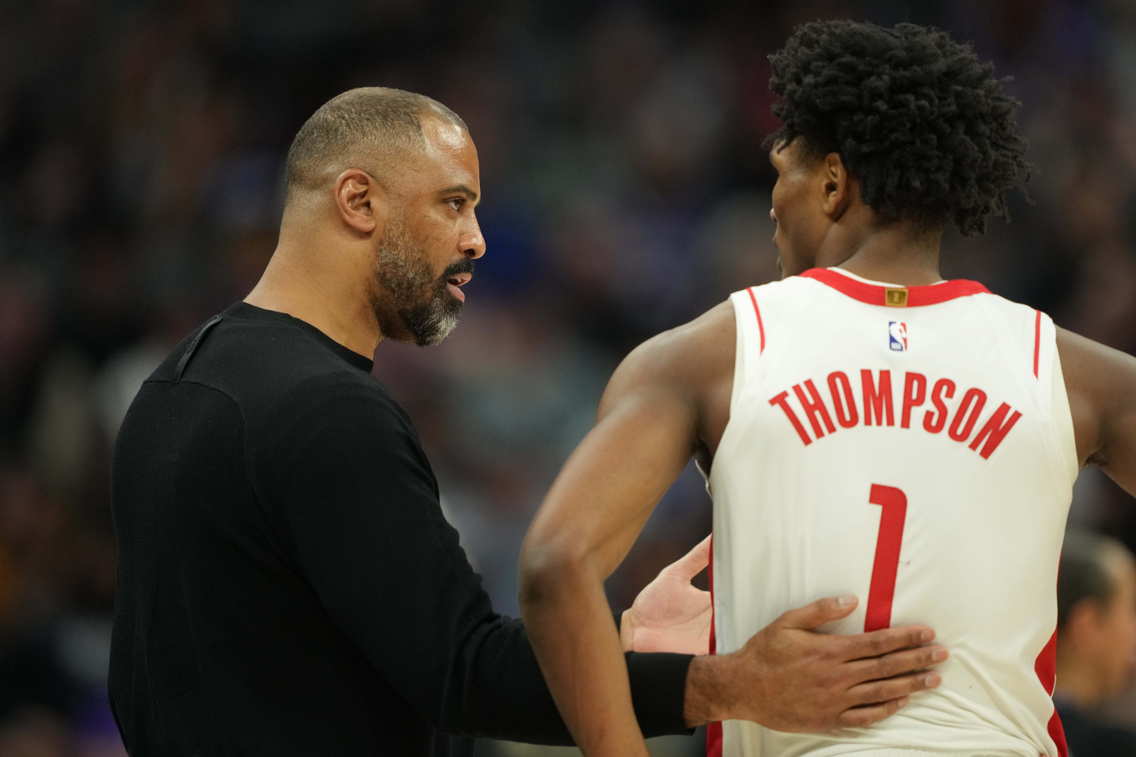 Mar 10, 2024; Sacramento, California, USA; Houston Rockets head coach Ime Udoka (left) talks with forward Amen Thompson (1) during the fourth quarter against the Sacramento Kings at Golden 1 Center.