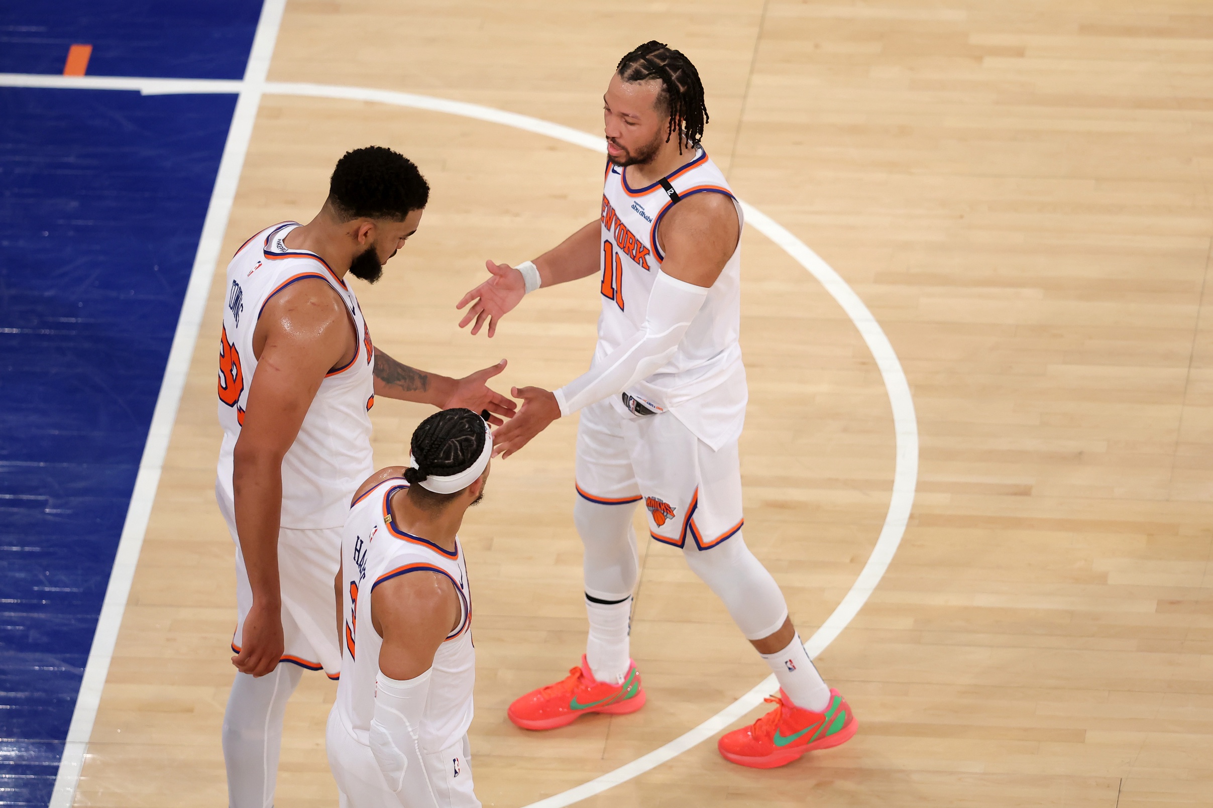 May 29, 2025; New York, New York, USA; New York Knicks guard Jalen Brunson (11) and center Karl-Anthony Towns (32) and guard Josh Hart (3) react in the fourth quarter against the Indiana Pacers during game five of the eastern conference finals for the 2025 NBA Playoffs at Madison Square Garden.