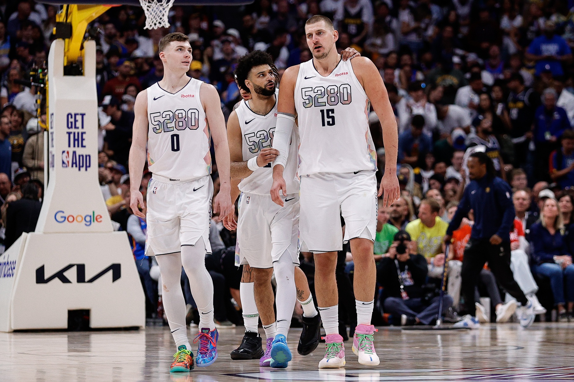May 15, 2025; Denver, Colorado, USA; Denver Nuggets guard Jamal Murray (27) and center Nikola Jokic (15) and guard Christian Braun (0) in the fourth quarter against the Oklahoma City Thunder during game six of the second round for the 2025 NBA Playoffs at Ball Arena.
