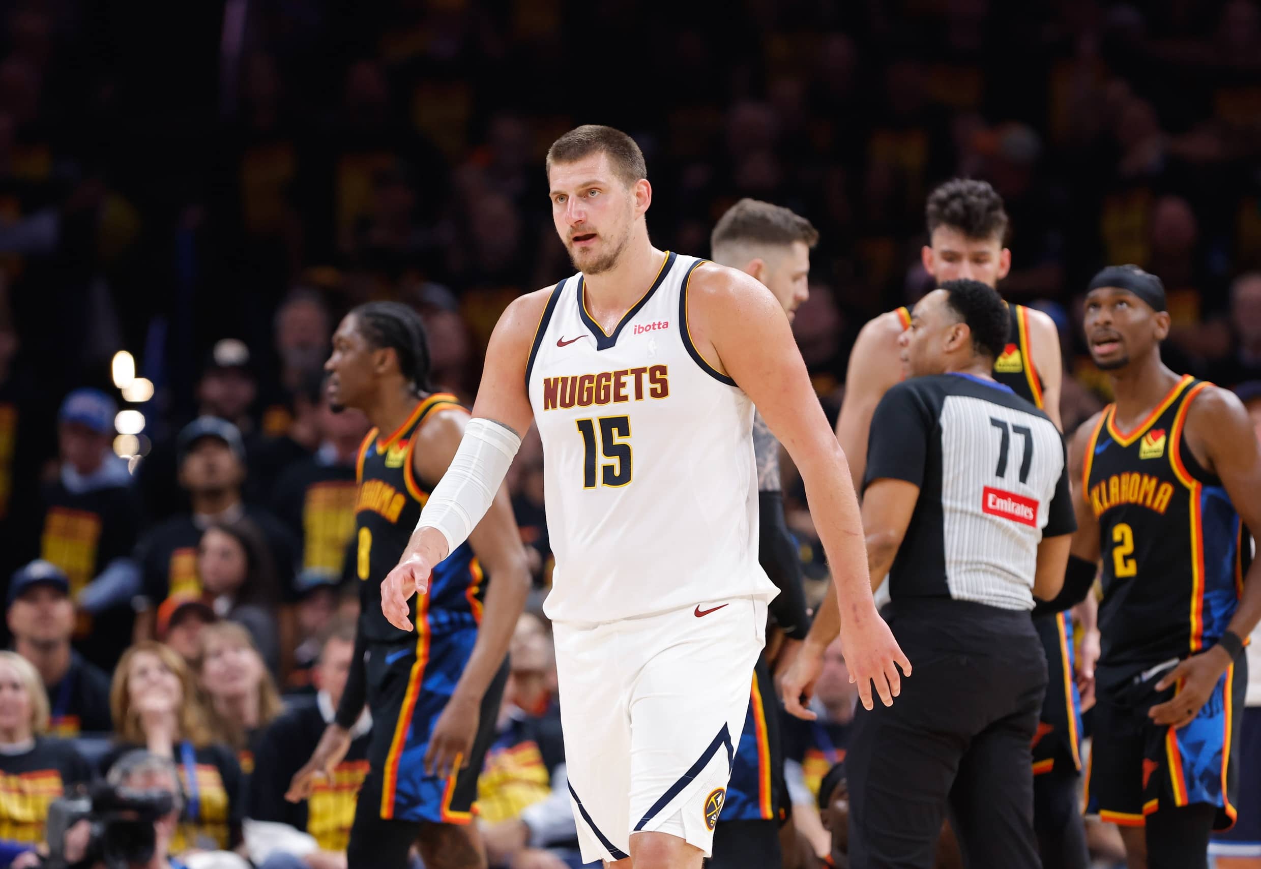 Oklahoma City, Oklahoma, USA; Denver Nuggets center Nikola Jokic (15) walks off the court during a timeout against the Oklahoma City Thunder in the second half of Game 1 of the second round of the 2025 NBA Playoffs at Paycom Center.