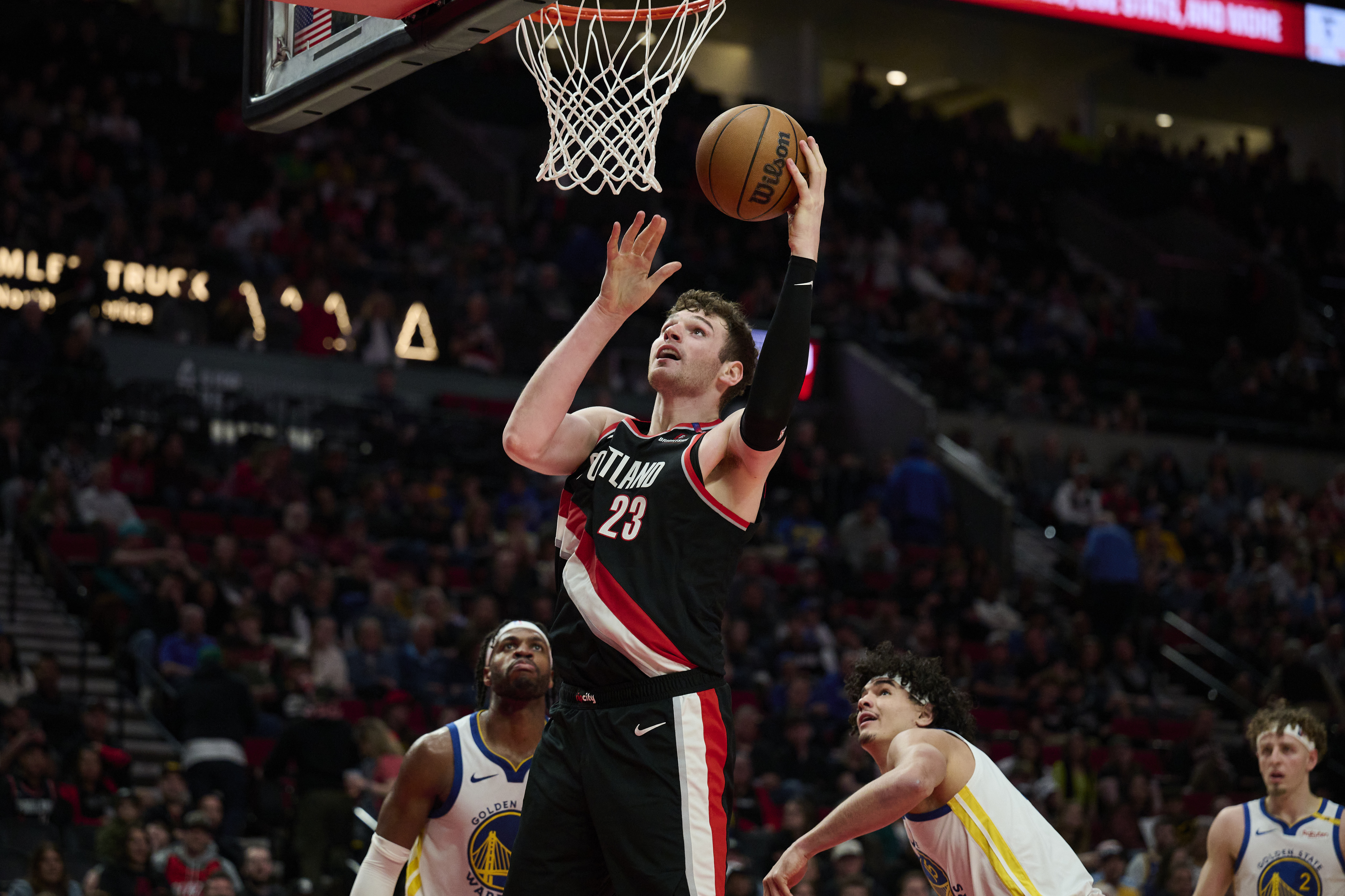 Apr 11, 2025; Portland, Oregon, USA; Portland Trail Blazers center Donovan Clingan (23) scores a basket during the second half against the Golden State Warriors at Moda Center. Mandatory Credit: Troy Wayrynen-Imagn Images  