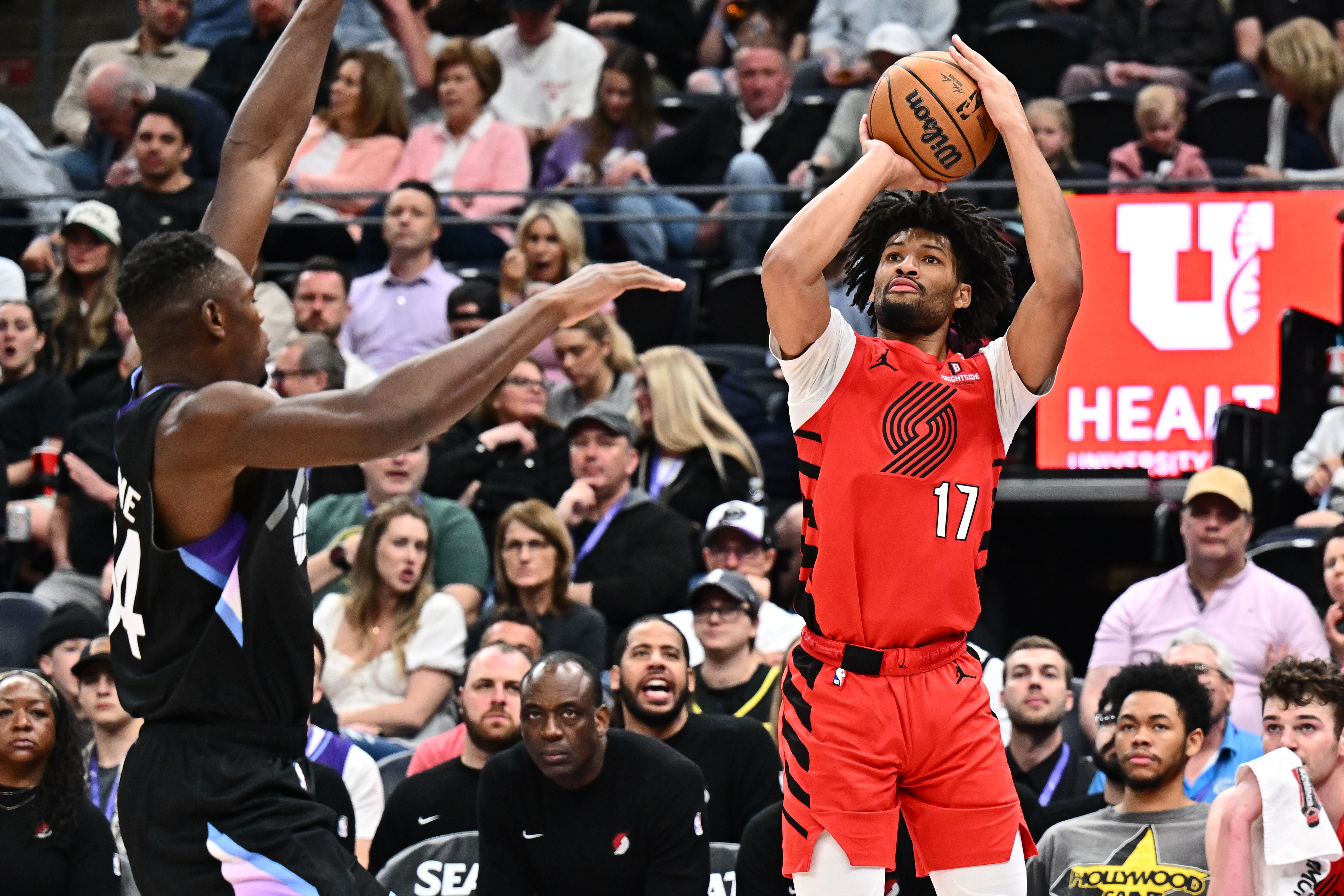 Apr 9, 2025; Salt Lake City, Utah, USA; Portland Trail Blazers guard Shaedon Sharpe (17) attempts a shot over Utah Jazz forward Oscar Tshiebwe (34) in the second half at Delta Center. Mandatory Credit: Jamie Sabau-Imagn Images  