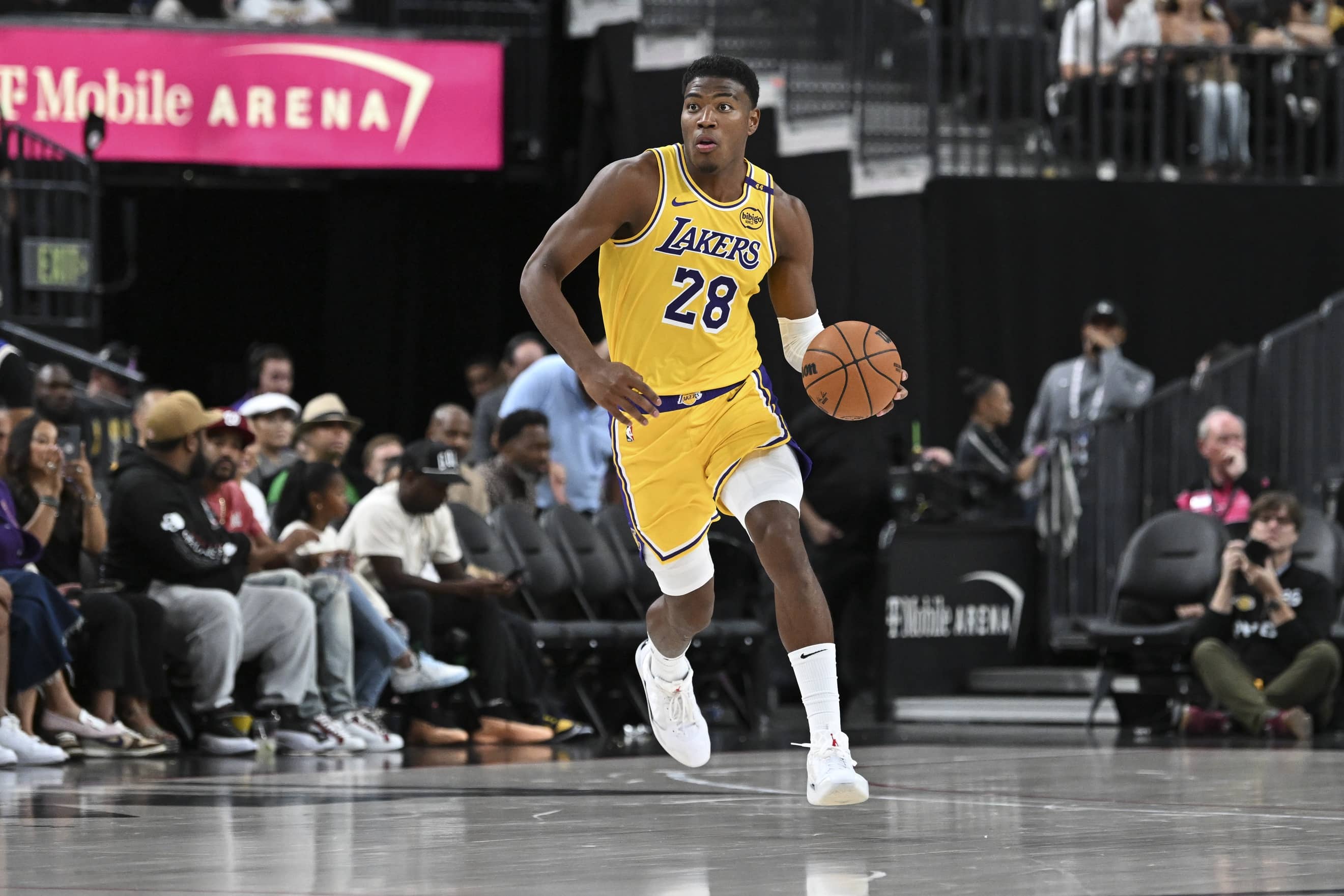 Las Vegas, Nevada, USA; Los Angeles Lakers forward Rui Hachimura (28) dribbles the ball up the court against the Golden State Warriors in the third quarter during a preseason game at T-Mobile Arena. Mandatory Credit: Candice Ward-Imagn Images