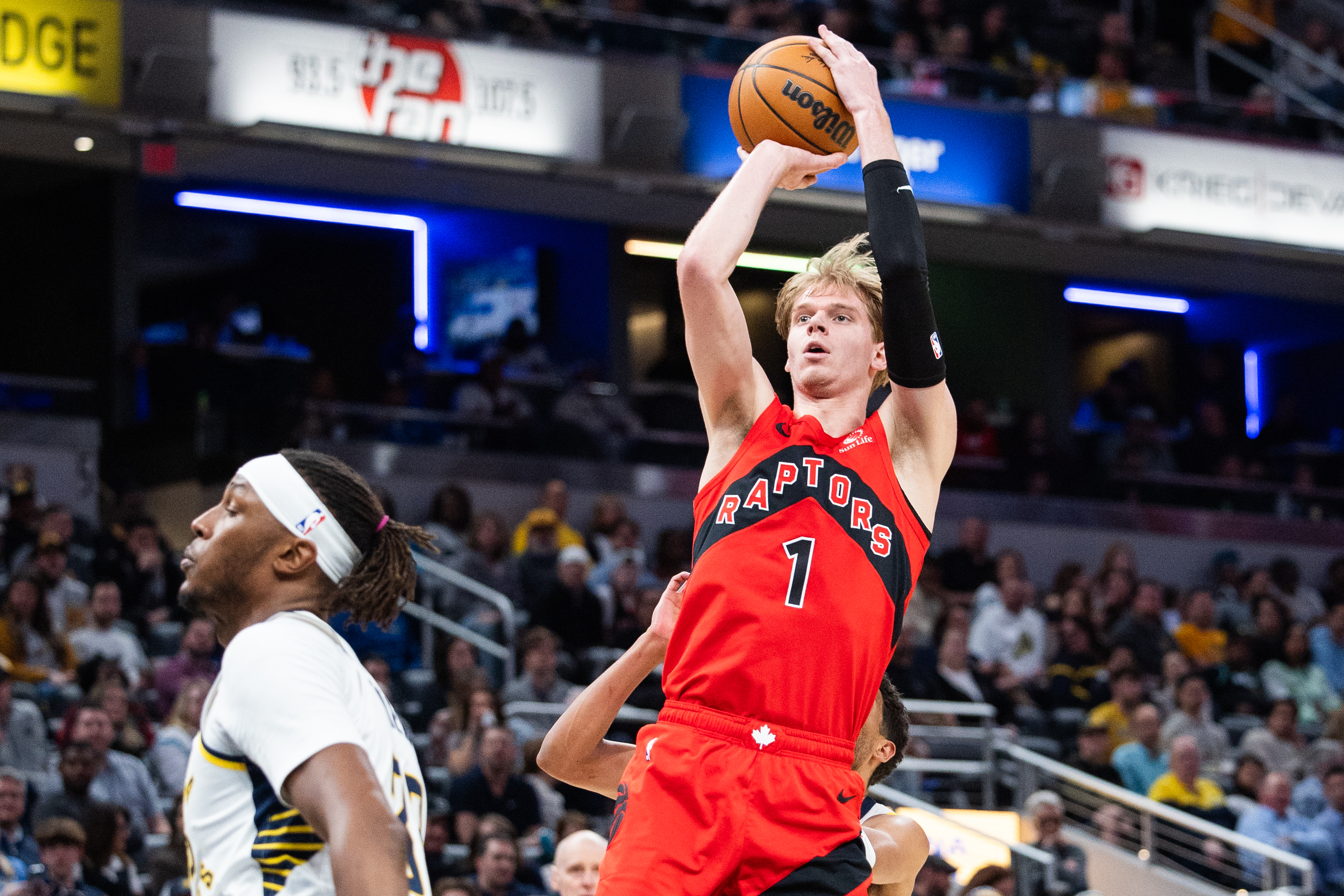 Feb 26, 2025; Indianapolis, Indiana, USA; Toronto Raptors guard Gradey Dick (1) shoots the ball while Indiana Pacers center Myles Turner (33) defends in the first half at Gainbridge Fieldhouse. Mandatory Credit: Trevor Ruszkowski-Imagn Images  