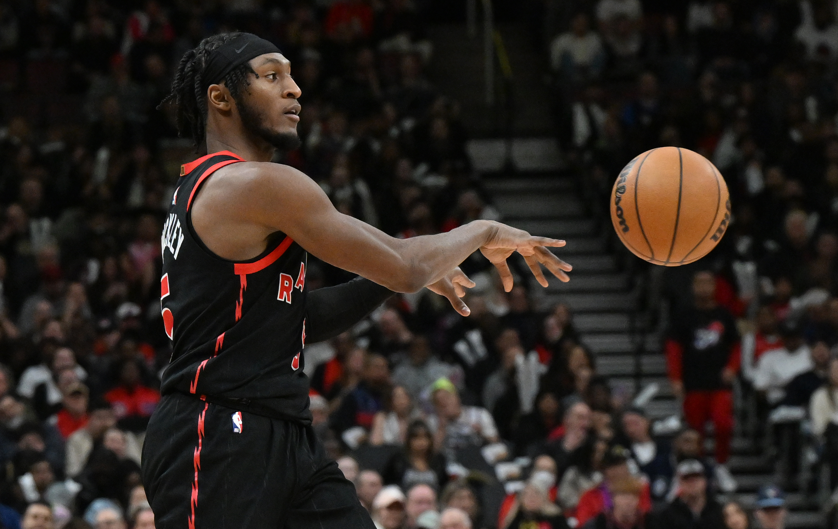 Apr 4, 2025; Toronto, Ontario, CAN; Toronto Raptors guard Immanuel Quickley (5) passes the ball against the Detroit Pistons in the second half at Scotiabank Arena. Mandatory Credit: Dan Hamilton-Imagn Images  