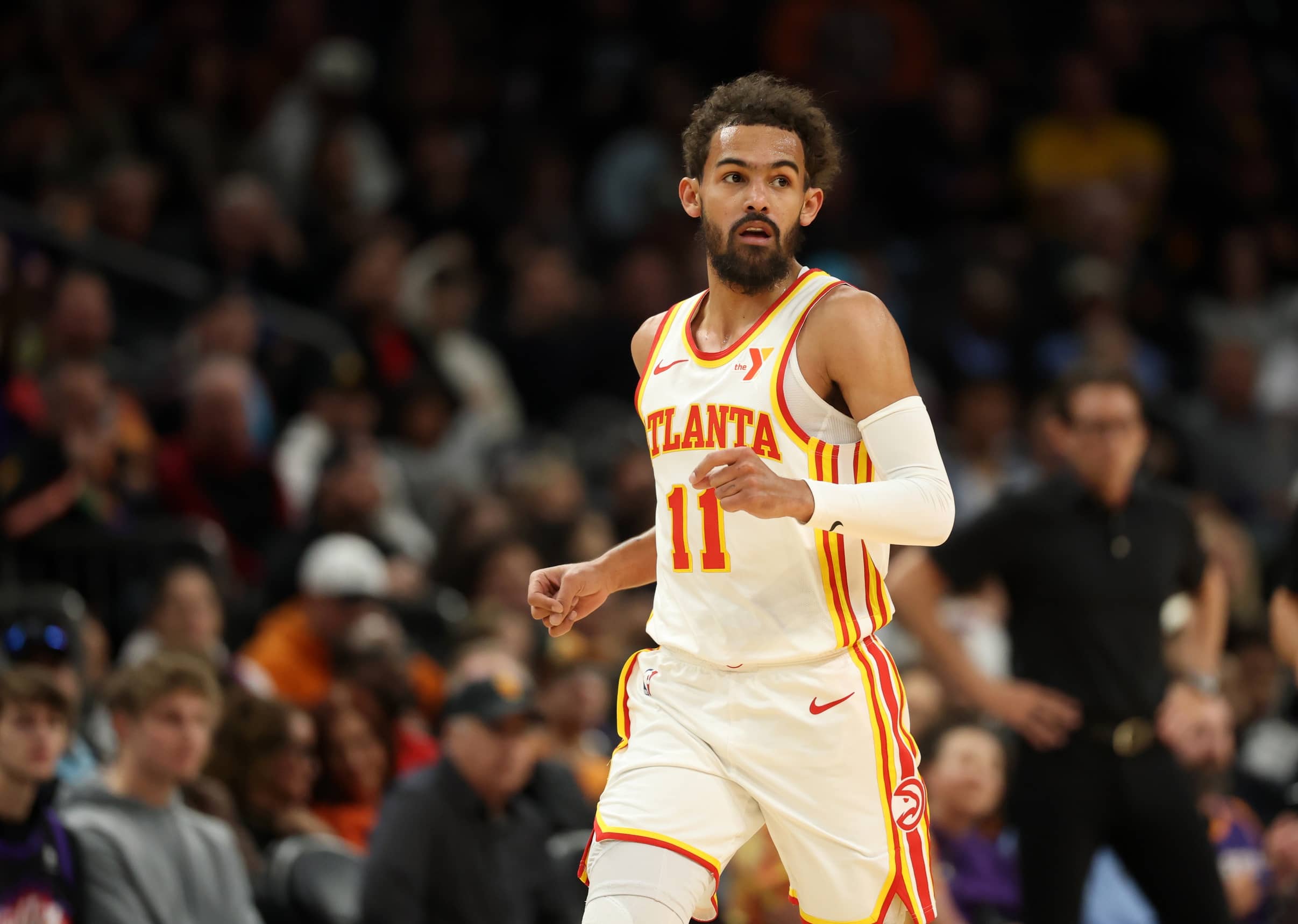 Jan 9, 2025; Phoenix, Arizona, USA; Atlanta Hawks guard Trae Young (11) against the Phoenix Suns at Footprint Center. Mandatory Credit: Mark J. Rebilas-Imagn Images