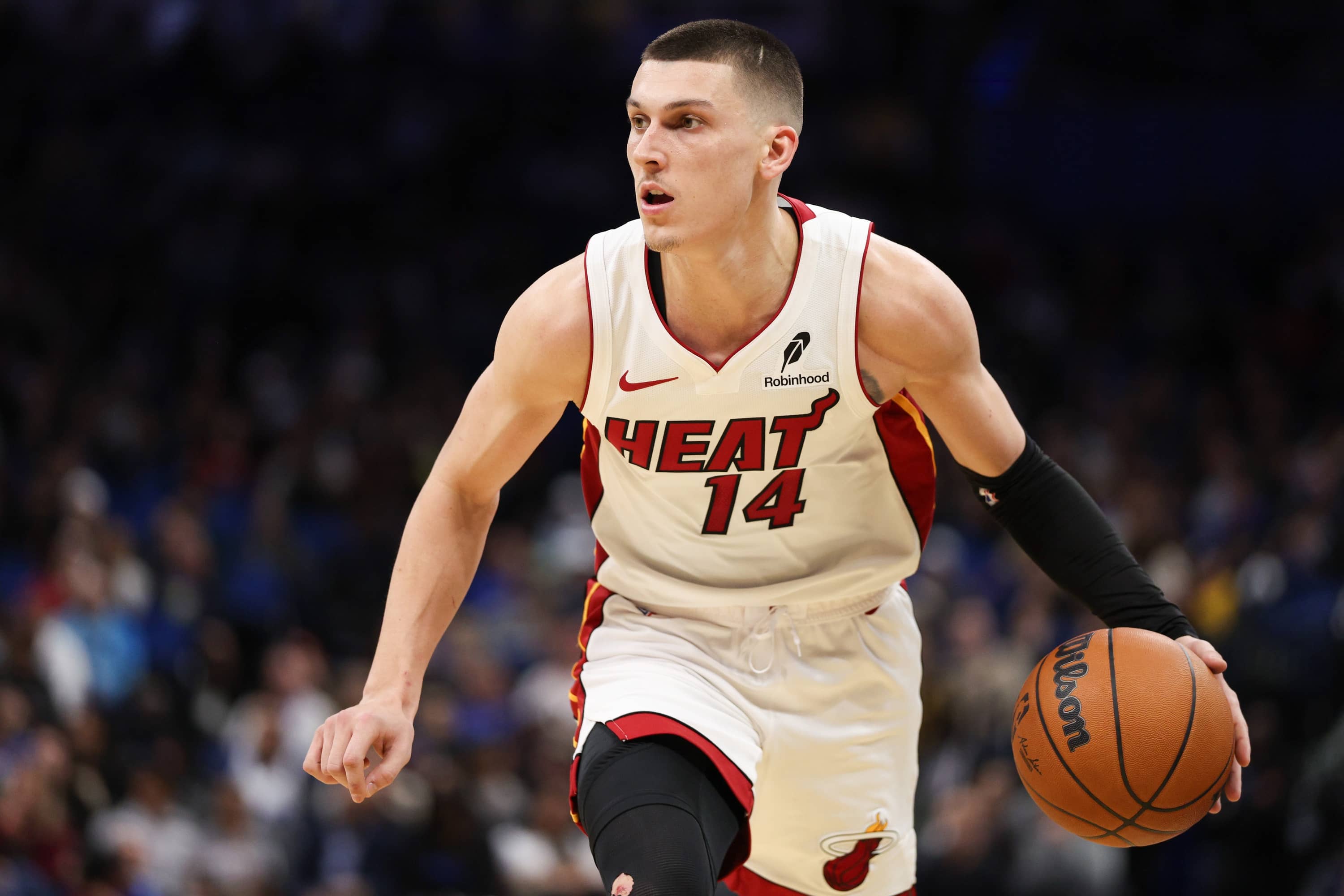 Dec 21, 2024; Orlando, Florida, USA; Miami Heat guard Tyler Herro (14) drives to the basket against the Orlando Magic in the second quarter at Kia Center. Mandatory Credit: Nathan Ray Seebeck-Imagn Images