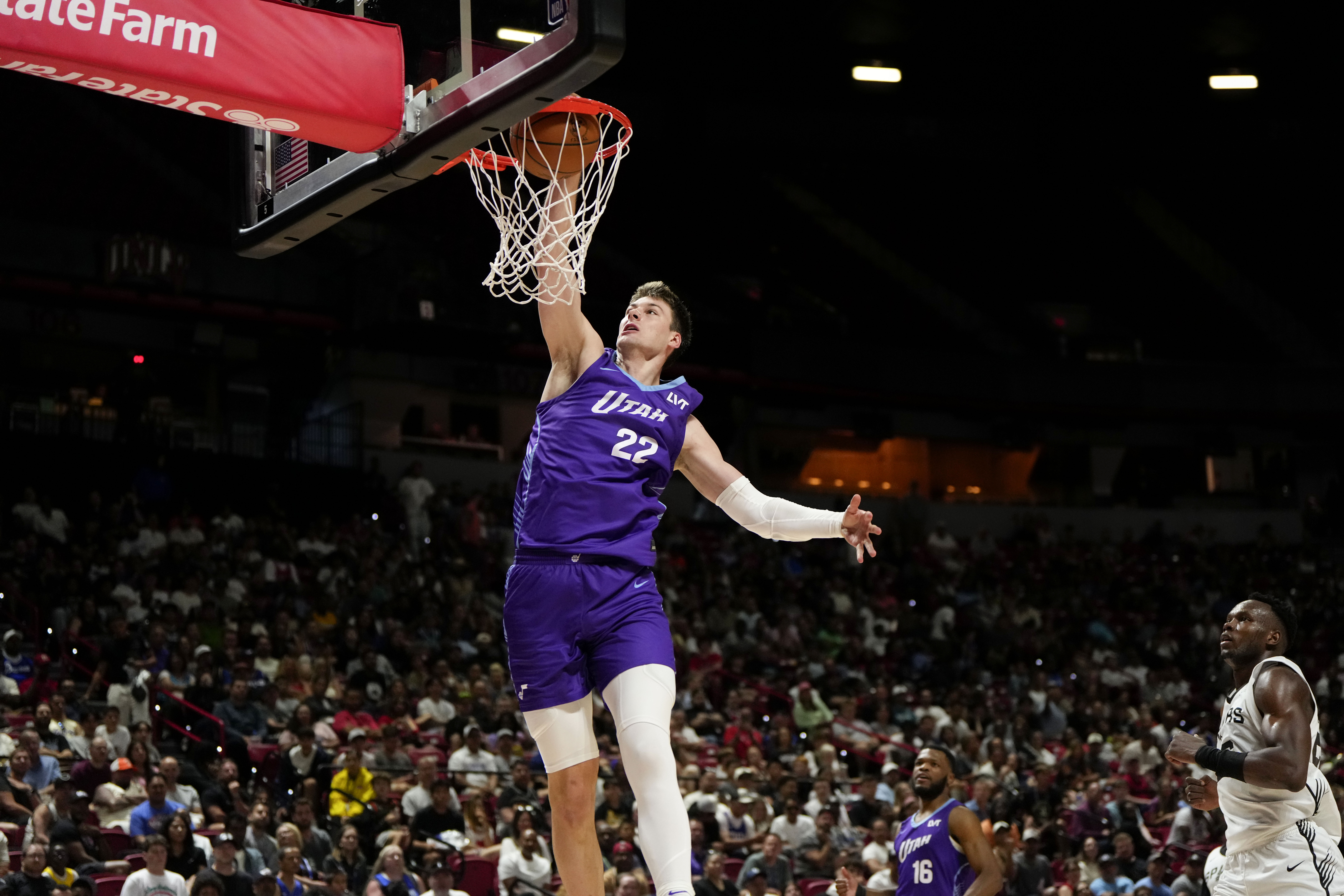 Jul 14, 2025; Las Vegas, NV, USA; Utah Jazz forward Kyle Filipowski (22) dunks the ball against the San Antonio Spurs during the first half of a NBA basketball game at the Thomas & Mack Center. Mandatory Credit: Lucas Peltier-Imagn Images  