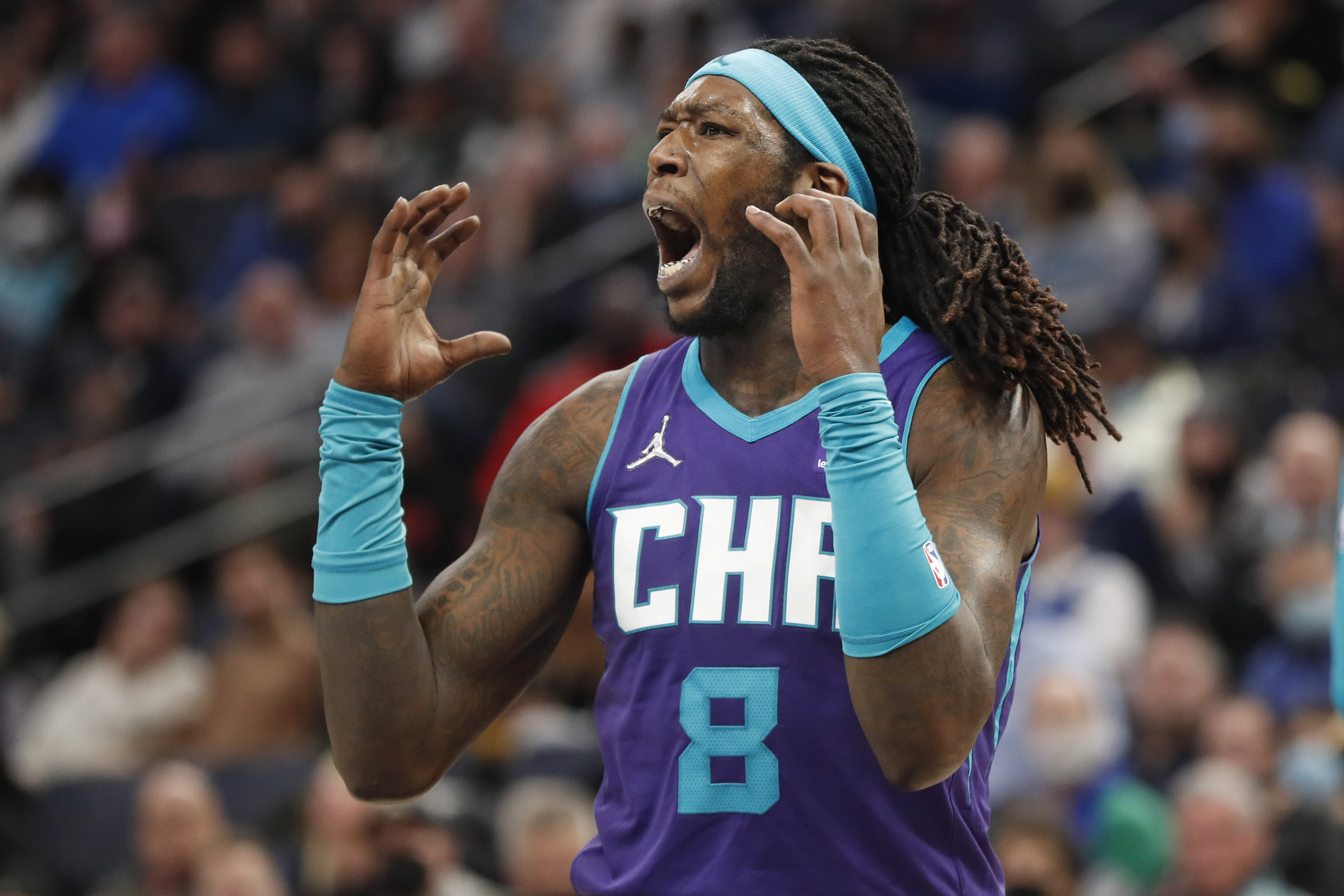 Feb 15, 2022; Minneapolis, Minnesota, USA; Charlotte Hornets center Montrezl Harrell (8) reacts to a referee's call against him and for the Minnesota Timberwolves in the second quarter at Target Center. Mandatory Credit: Bruce Kluckhohn-Imagn Images  