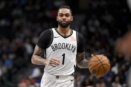 Mar 31, 2025; Dallas, Texas, USA; Brooklyn Nets guard D'Angelo Russell (1) in action during the game between the Dallas Mavericks and the Brooklyn Nets at the American Airlines Center. Mandatory Credit: Jerome Miron-Imagn Images
