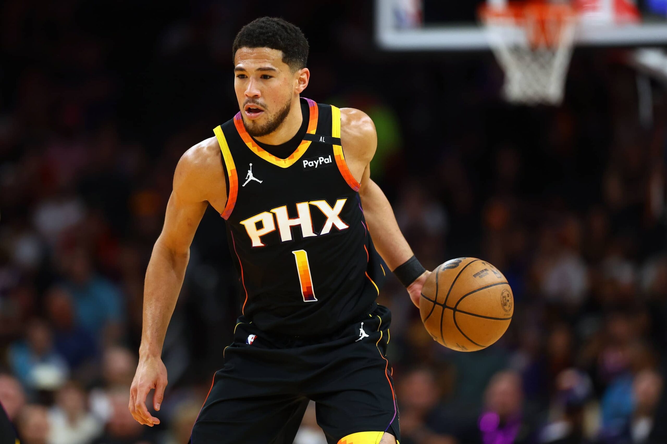 Devin Booker dribbles during a game between the Phoenix Suns and Oklahoma City Thunder. Mandatory Credit: Imagn-Images