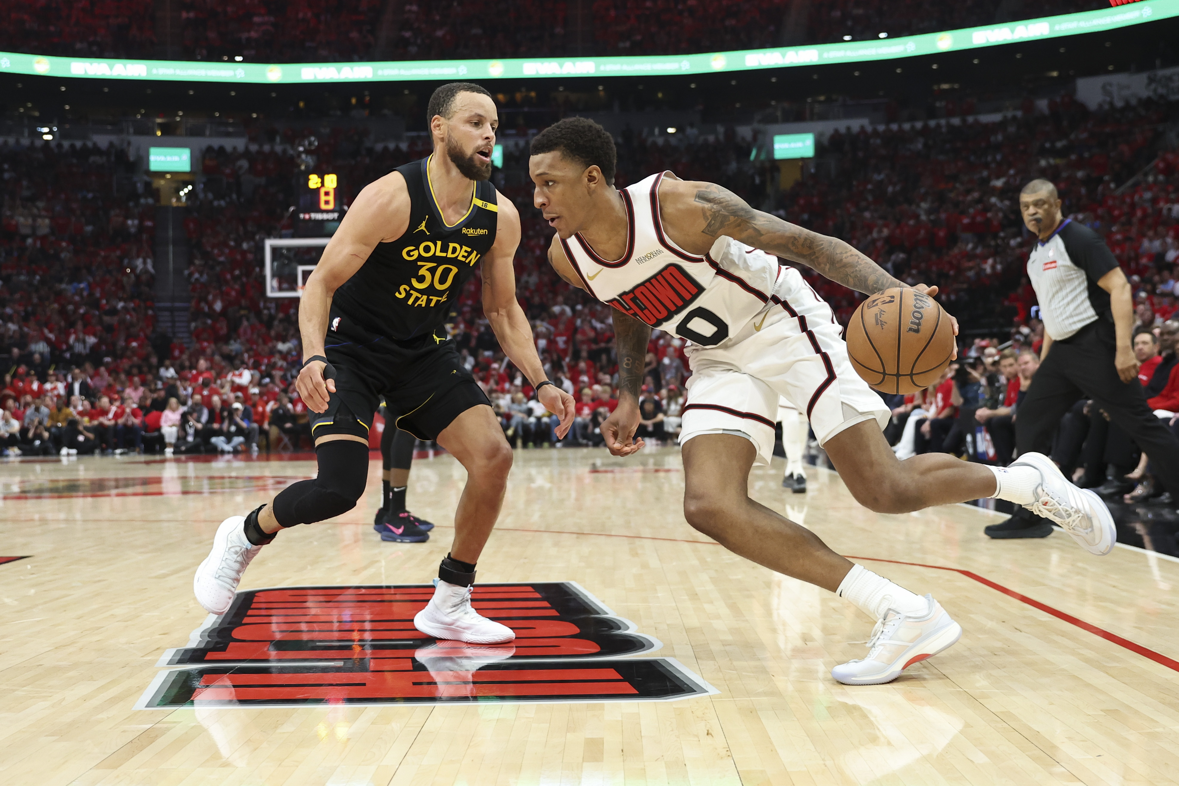 May 4, 2025; Houston, Texas, USA; Houston Rockets forward Jabari Smith Jr. (10) dribbles the ball as Golden State Warriors guard Stephen Curry (30) defends during the third quarter of game seven of the first round for the 2025 NBA Playoffs at Toyota Center. Mandatory Credit: Troy Taormina-Imagn Images  
