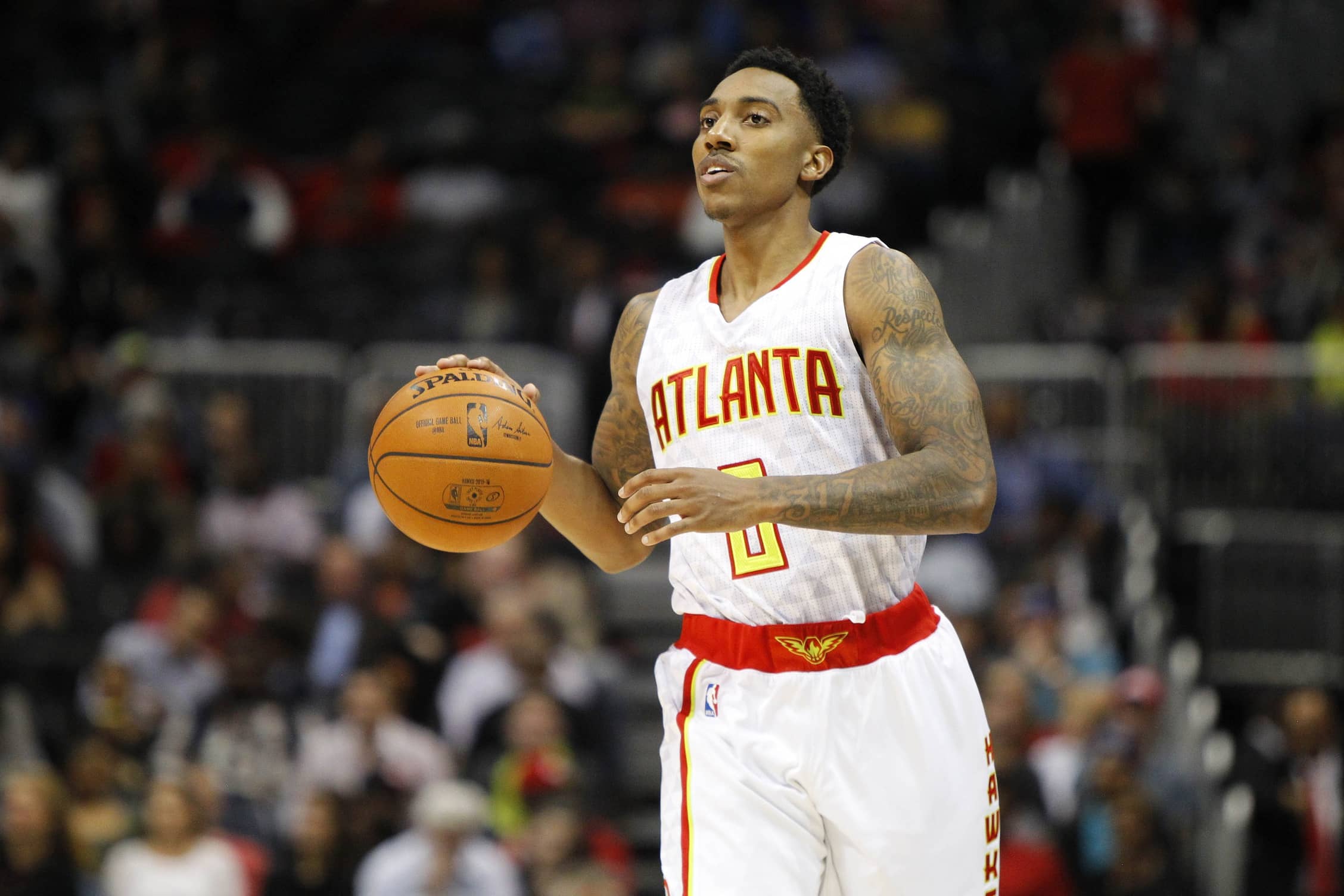 Atlanta Hawks guard Jeff Teague (0) dribbles the ball against the Charlotte Hornets in the third quarter at Philips Arena. The Hawks won 97-94.