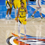 Indiana Pacers guard Tyrese Haliburton (0) walks back to the team bench in the first quarter against the Oklahoma City Thunder during game five of the 2025 NBA Finals at Paycom Center. Mandatory Credit: Alonzo Adams-Imagn Images