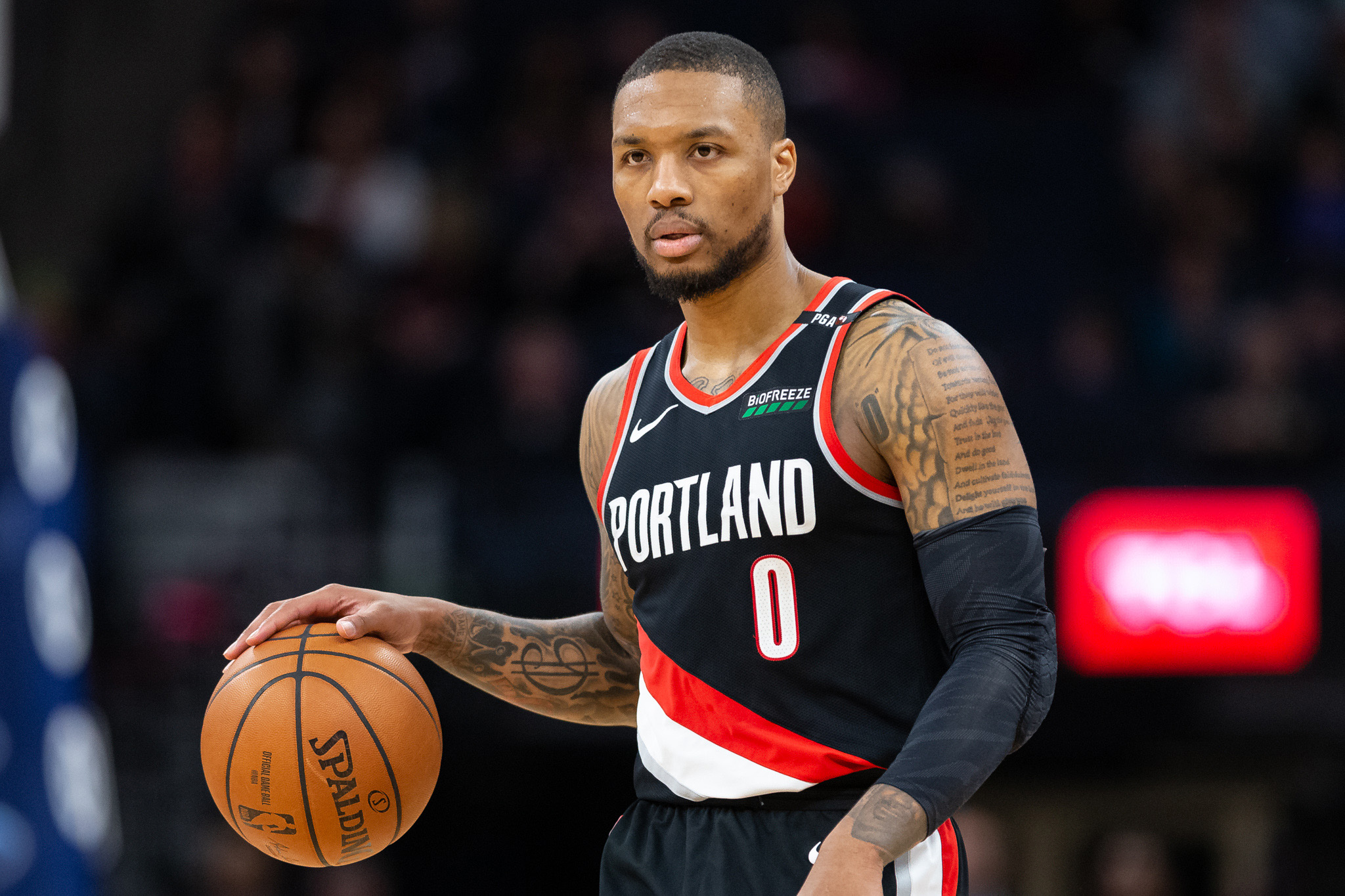 Apr 1, 2019; Minneapolis, MN, USA; Portland Trail Blazers guard Damian Lillard (0) dribbles the ball during the third quarter against the Minnesota Timberwolves at Target Center. Mandatory Credit: Harrison Barden-Imagn Images  