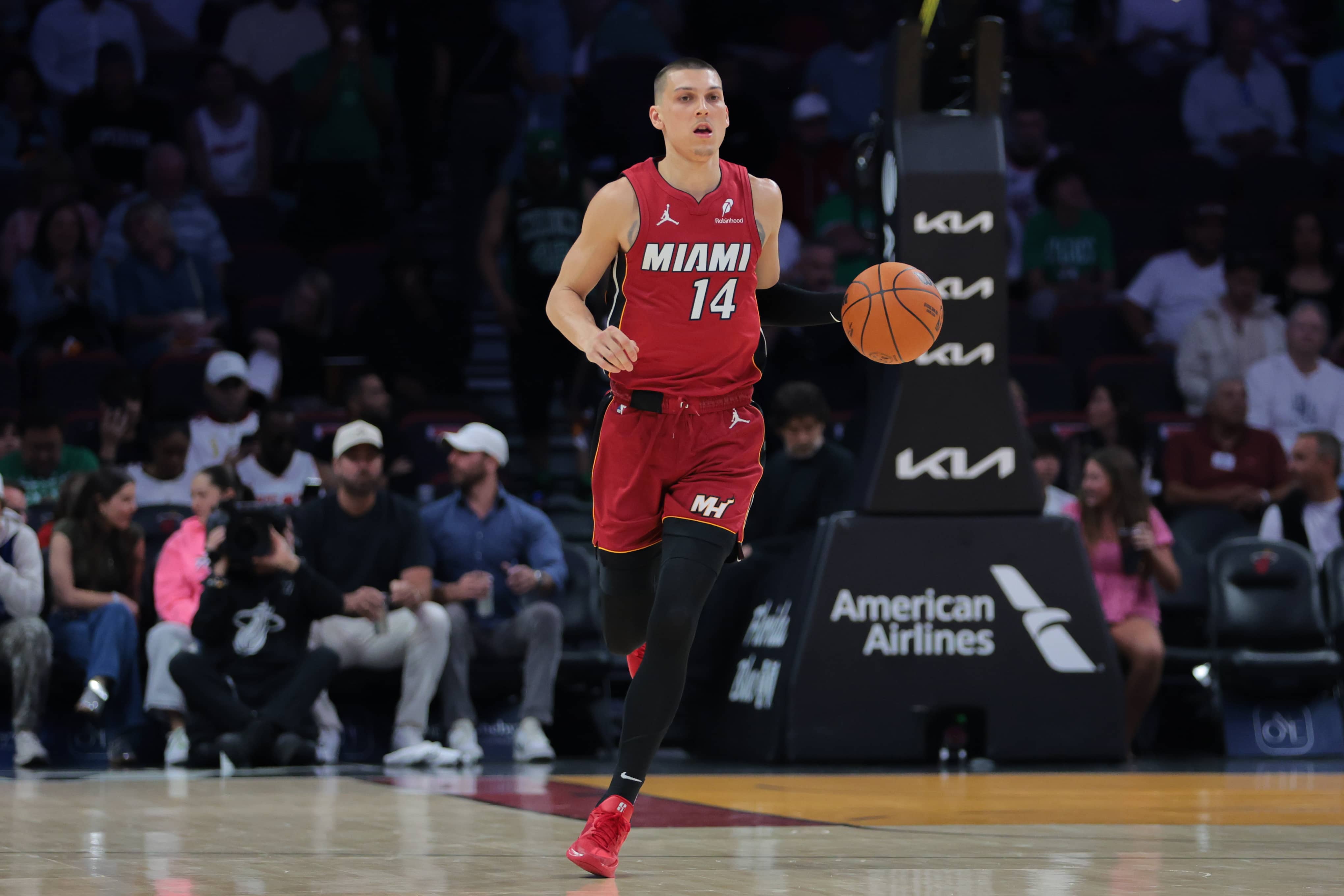 Miami, Florida, USA; Miami Heat guard Tyler Herro (14) dribbles the basketball against the Boston Celtics during the first quarter at Kaseya Center.