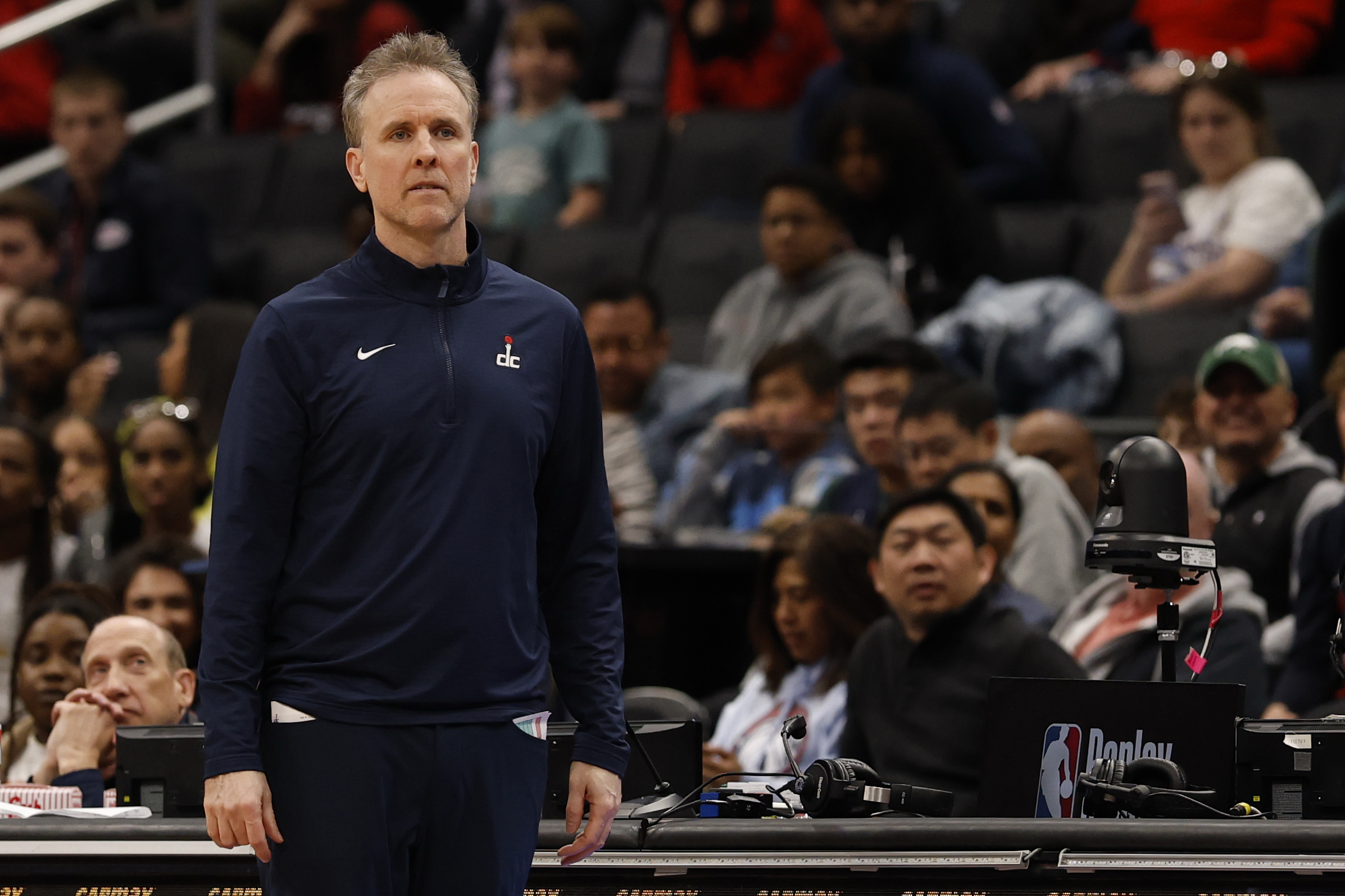 Apr 9, 2025; Washington, District of Columbia, USA; Washington Wizards head coach Brian Keefe looks on from the bench against the Philadelphia 76ers in the second half at Capital One Arena. Mandatory Credit: Geoff Burke-Imagn Images  