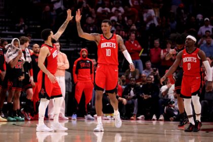 Mar 15, 2025; Houston, Texas, USA; Houston Rockets guard Fred VanVleet (5) congratulates Houston Rockets forward Jabari Smith Jr (10) against the Chicago Bulls during the fourth quarter at Toyota Center. Mandatory Credit: Erik Williams-Imagn Images