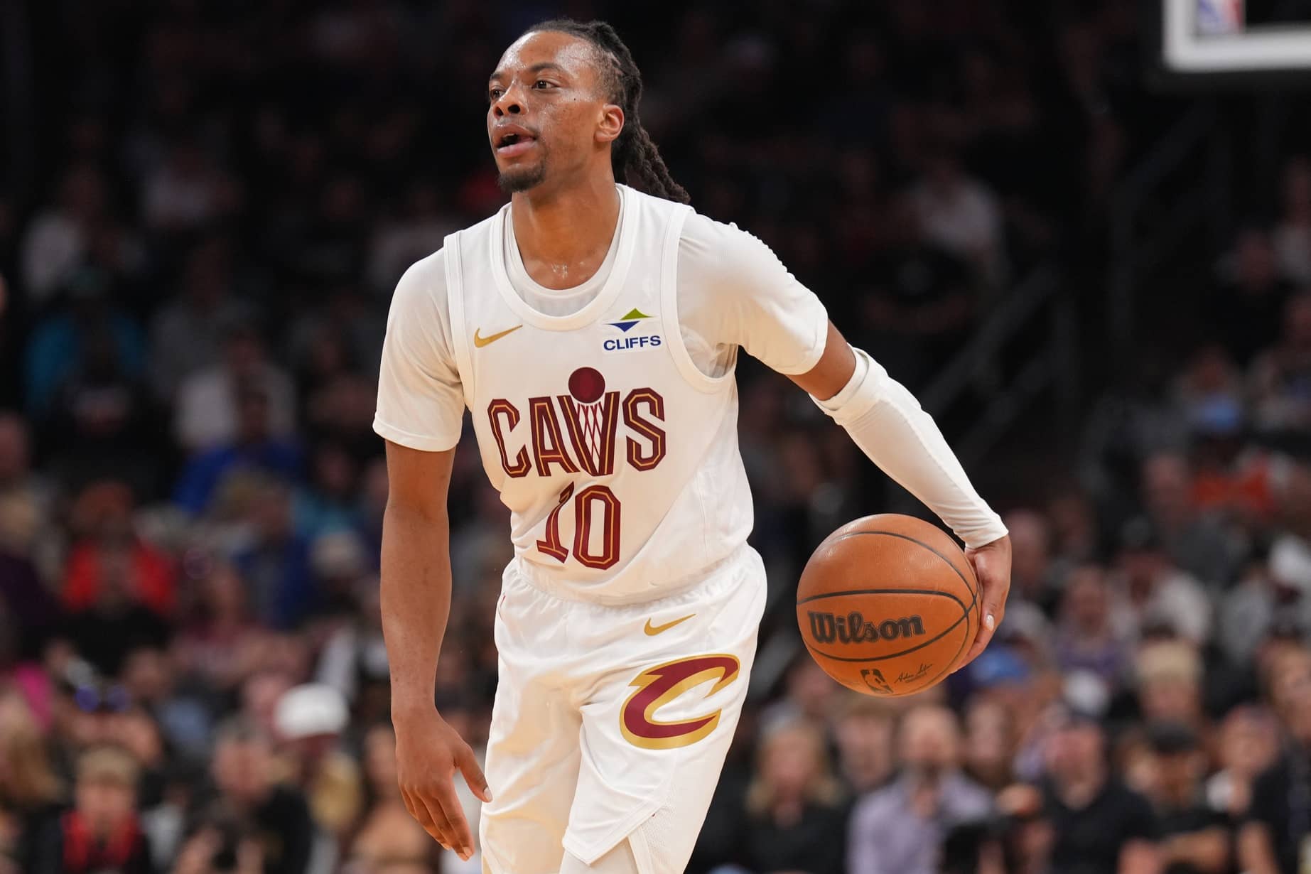 Cavaliers guard Darius Garland dribbles against the Suns during the first half at Footprint Center