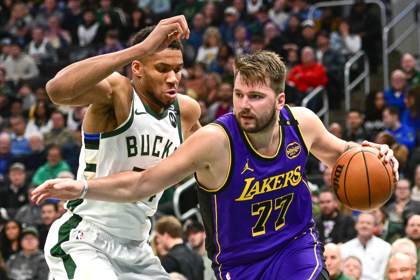 Lakers guard Luka Doncic drives to the basket against Bucks forward Giannis Antetokounmpo in the third quarter at Fiserv Forum