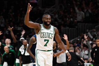 Celtics guard Jaylen Brown reacts to his three point basket against the Timberwolves during the second half at TD Garden. Mandatory Credit: Eric Canha-Imagn Images
