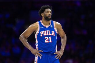 6ers center Joel Embiid looks on during the third quarter against the Celtics at Wells Fargo Center