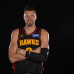 Atlanta Hawks center Kristaps Porzingis poses for a photo during Media Day