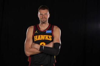 Atlanta Hawks center Kristaps Porzingis poses for a photo during Media Day