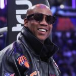 Stephon Marbury prepares to watch the game between the Minnesota Timberwolves and the New York Knicks at Madison Square Garden