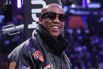 Stephon Marbury prepares to watch the game between the Minnesota Timberwolves and the New York Knicks at Madison Square Garden