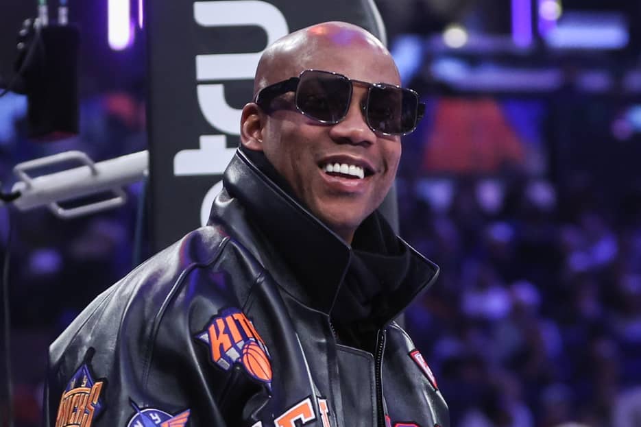 Stephon Marbury prepares to watch the game between the Minnesota Timberwolves and the New York Knicks at Madison Square Garden