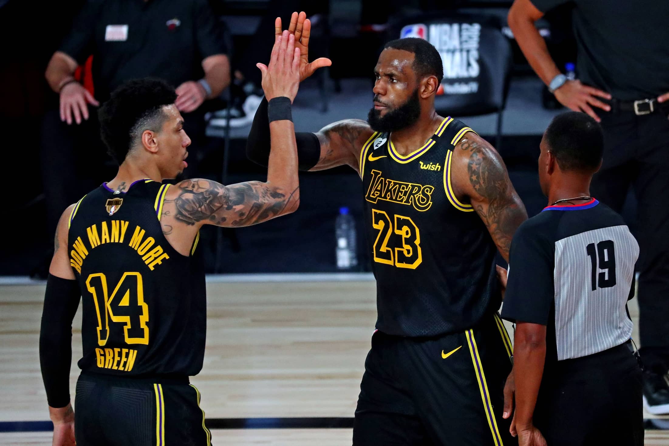 Oct 2, 2020; Orlando, Florida, USA; Los Angeles Lakers forward LeBron James (23) celebrates with guard Danny Green (14) after a play during the third quarter against the Miami Heat in game two of the 2020 NBA Finals at AdventHealth Arena. Mandatory Credit: Kim Klement-Imagn Images