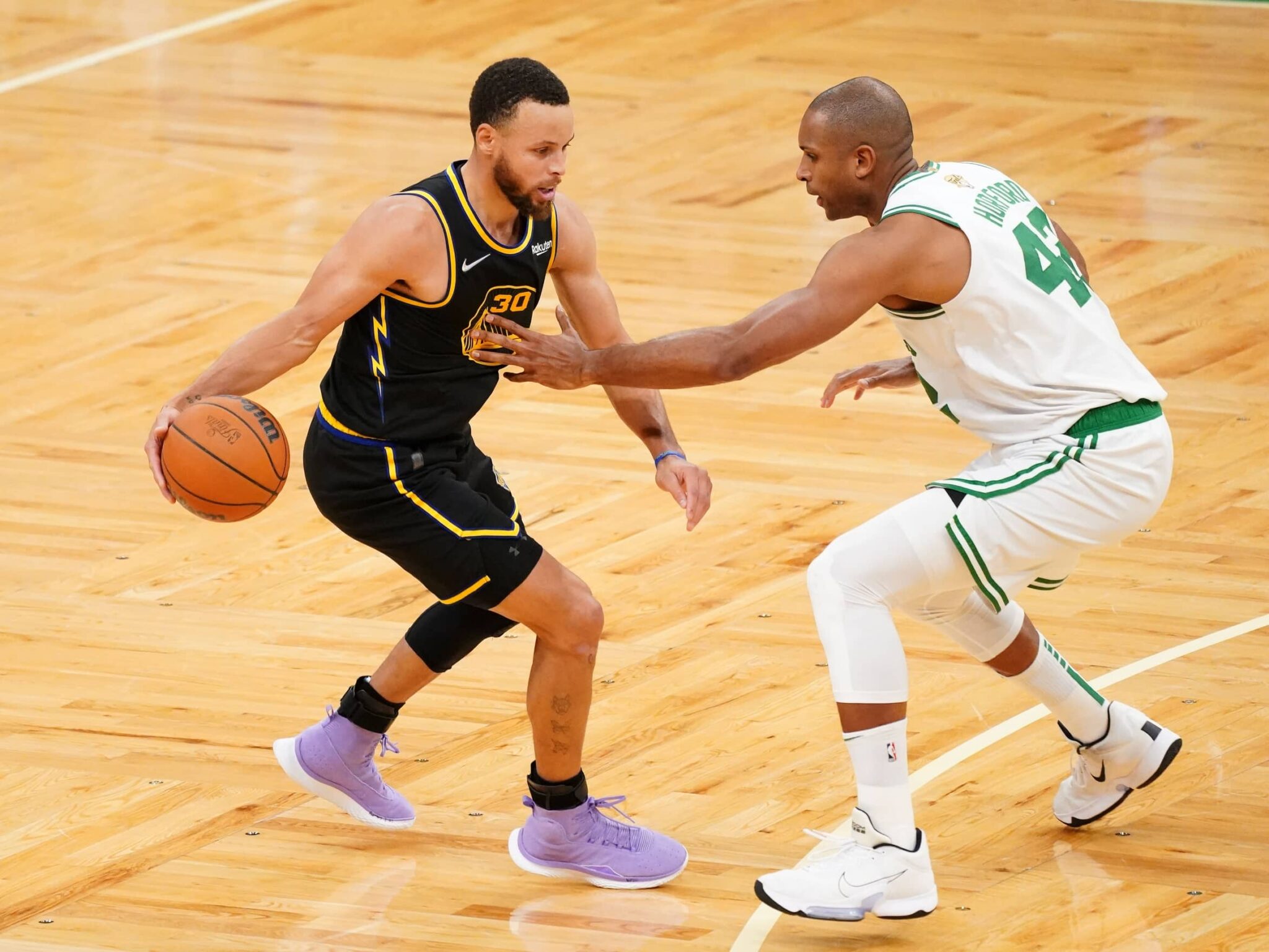Jun 10, 2022; Boston, Massachusetts, USA; Boston Celtics center Al Horford (42) defends Golden State Warriors guard Stephen Curry (30) during the fourth quarter of game four in the 2022 NBA Finals at the TD Garden. Mandatory Credit: David Butler II-Imagn Images