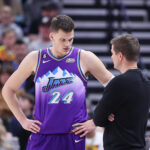 Mar 18, 2023; Salt Lake City, Utah, USA; Utah Jazz center Walker Kessler (24) and head coach Will Hardy speak during a break first quarter action against the Boston Celtics at Vivint Arena. Mandatory Credit: Rob Gray-Imagn Images