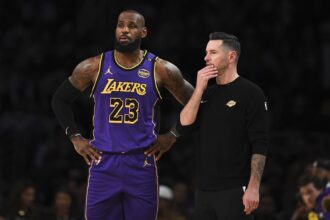 Lakers forward LeBron James with head coach JJ Redick against the Suns during the first half at Crypto.com Arena