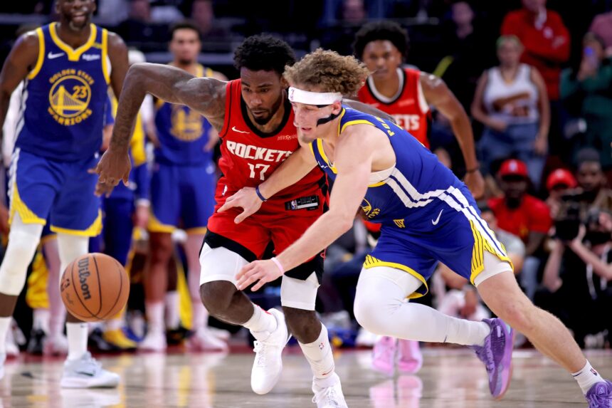 Nov 2, 2024; Houston, Texas, USA; Houston Rockets forward Tari Eason (17) and Golden State Warriors guard Brandin Podziemski (2) dive for the ball during the fourth quarter at Toyota Center. Mandatory Credit: Erik Williams-Imagn Images