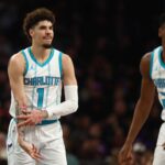 Jan 12, 2025; Phoenix, Arizona, USA; Charlotte Hornets guard LaMelo Ball (1) reacts after a basket against the Phoenix Suns during the first half at Footprint Center. Mandatory Credit: Mark J. Rebilas-Imagn Images